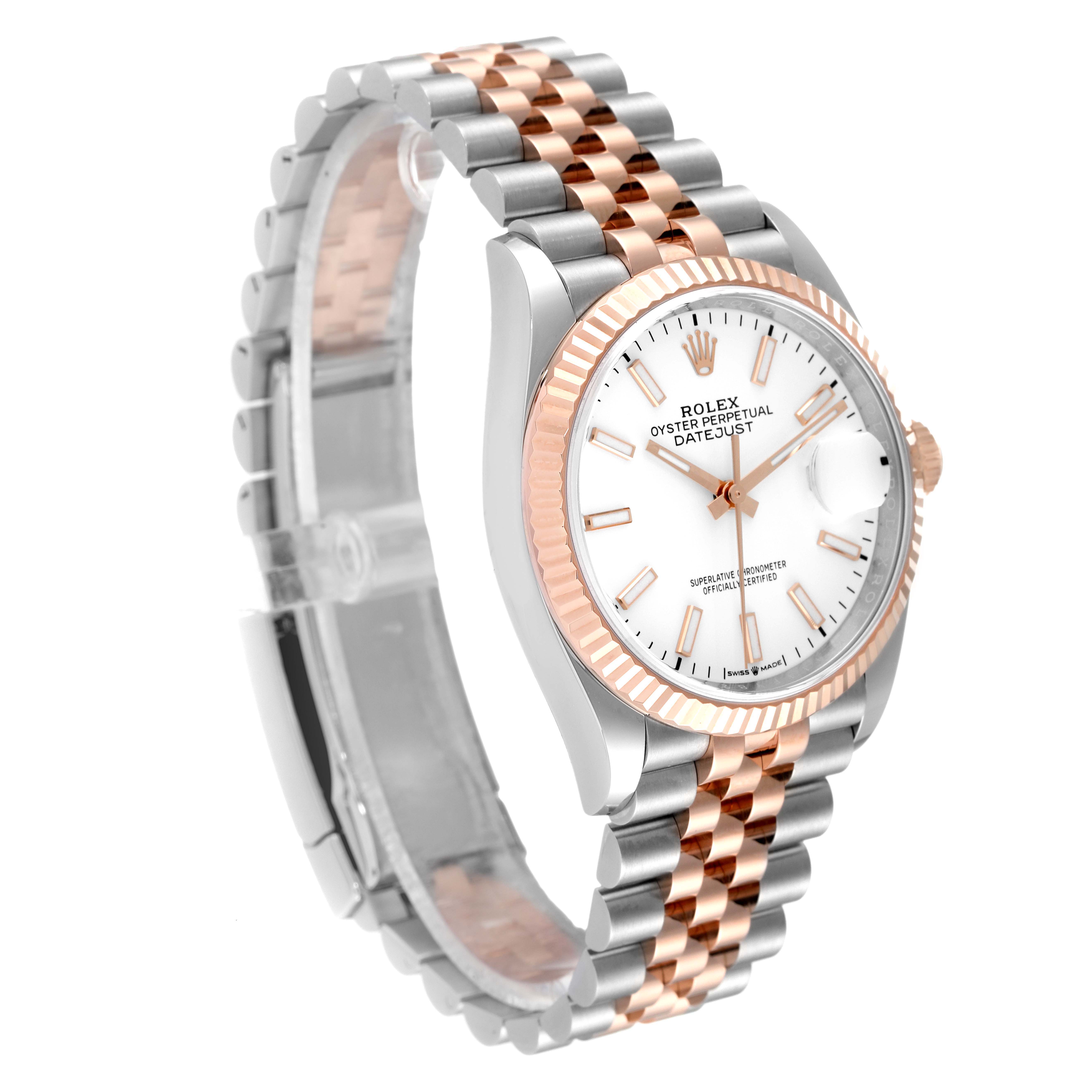This image shows a Rolex Datejust 126231 Men's Steel and Gold (two tone) White Dial 126231 Men's Steel and Gold (two tone) White Dial watch from a three-quarter angle, highlighting the two-tone bracelet, fluted bezel, and white dial.