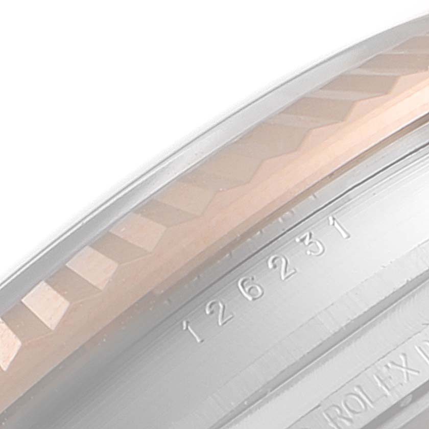 The image shows a close-up of the side of the bezel and engraving of a Rolex Datejust 126231 Men's Steel and Gold (two tone) White Dial 126231 Men's Steel and Gold (two tone) White Dial, including part of the model number.