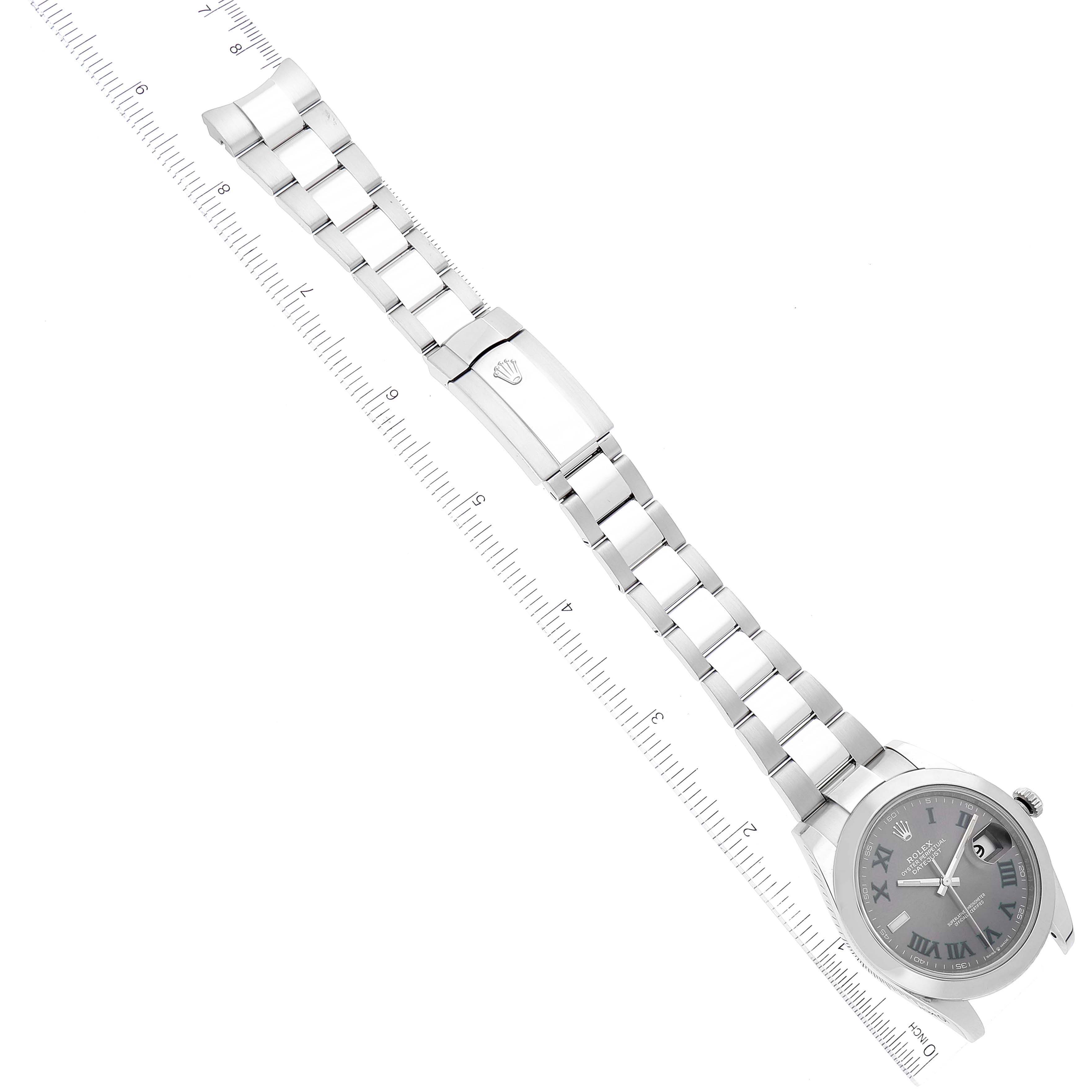 The image shows an overhead view of the Rolex Datejust 41 126300 Men's Stainless Steel Grey Dial 126300 Men's Stainless Steel Grey Dial watch, displaying its face, bracelet, and clasp, aligned with a ruler.