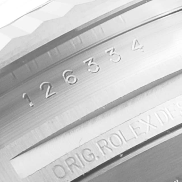 This image shows a close-up angle of the inner bezel engraving, featuring the serial number and "ORIG. ROLEX DESIG" text on a Rolex Datejust 41 126334 Men's Stainless Steel Black Dial 126334 Men's Stainless Steel Black Dial.