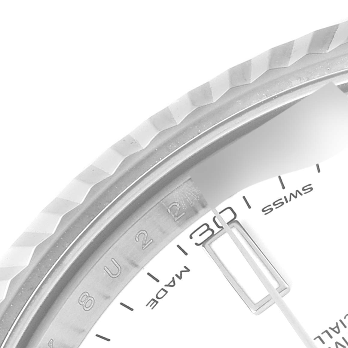 The image shows a close-up of the bezel and partial dial of the Rolex Datejust 41 116334 Men's Stainless Steel White Dial 116334 Men's Stainless Steel White Dial, highlighting the date window and minute markers.