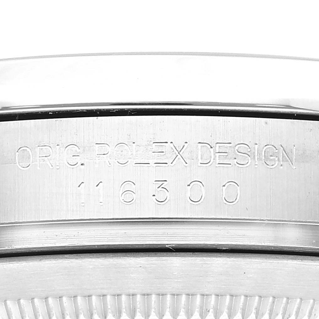 This image shows a close-up of the case side engraving on a Rolex Datejust 41 116300 Men's Stainless Steel Blue Dial 116300 Men's Stainless Steel Blue Dial model, displaying "ORIG. ROLEX DESIGN 116300."