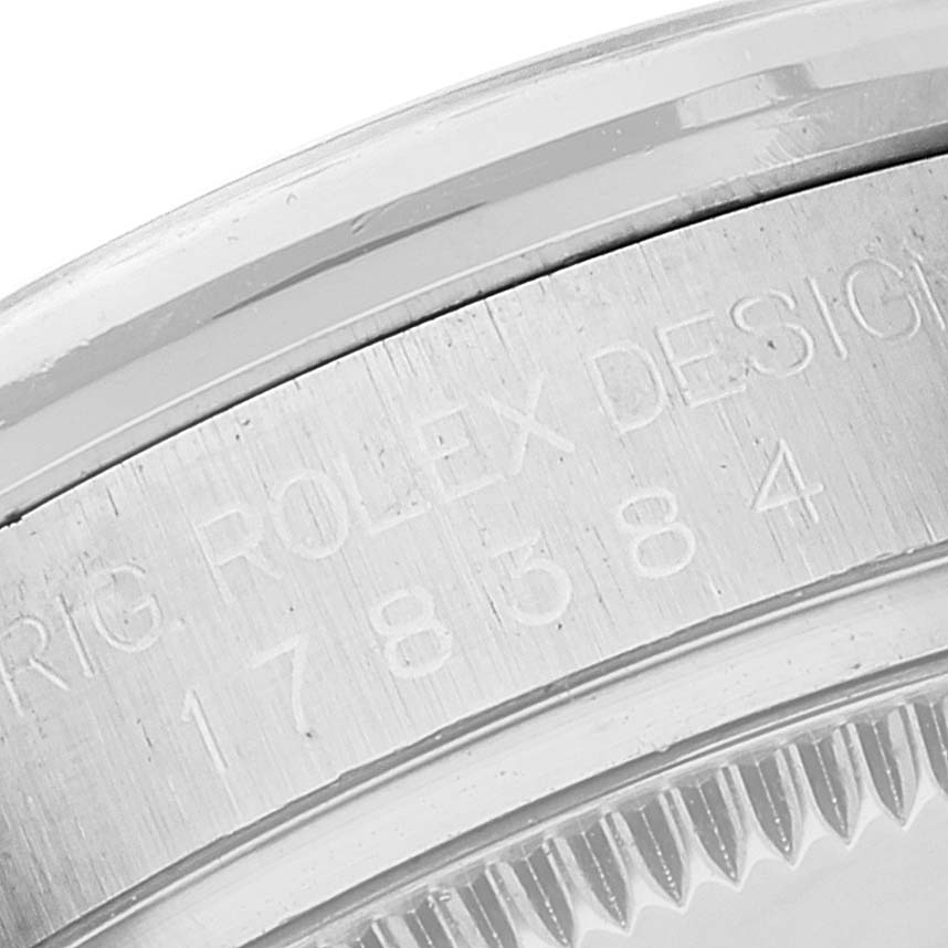 The image shows a close-up of the casing and model number engraving on a Rolex Mid-Size 178384 Women
s Stainless Steel Mother of Pearl Dial 178384 Women
s Stainless Steel Mother of Pearl Dial watch.