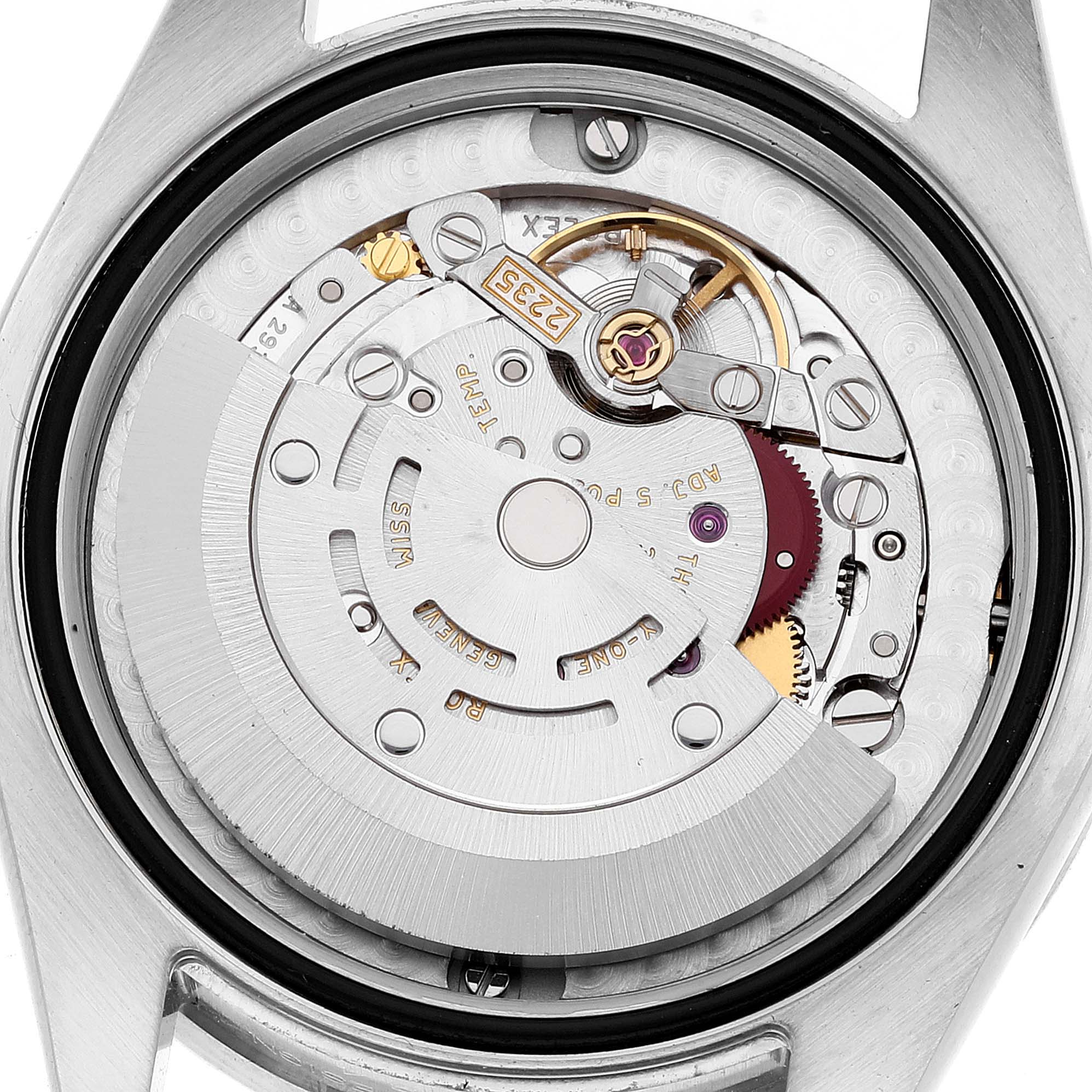 This image shows the internal movement mechanism of a Mid-Size Rolex watch from the back angle.