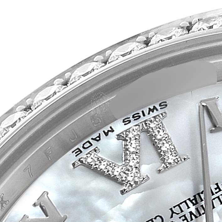 The image shows a close-up of the bezel and dial area of a Mid-Size Rolex, featuring diamond accents and the "Swiss Made" marking.