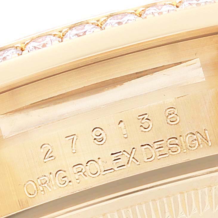 The image shows a close-up of the inner case back of a Rolex President 279138 Women's Yellow Gold Blue Dial 279138 Women's Yellow Gold Blue Dial model watch, revealing its serial number and "ORIG ROLEX DESIGN" engraving.