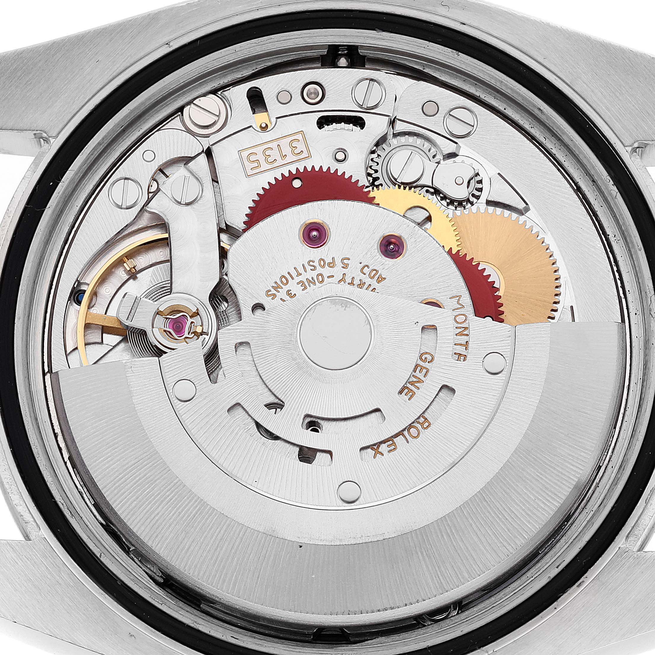This image shows the intricate inner mechanism of a Rolex Datejust 116231 Men's Steel and Gold (two tone) White Dial 116231 Men's Steel and Gold (two tone) White Dial watch from a rear angle.