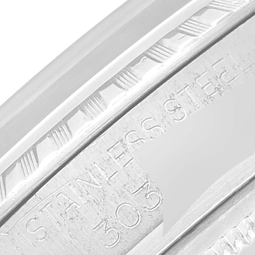 This close-up image shows the etching on the inner bezel of a Rolex Datejust 1603 Men's Stainless Steel Silver Dial 1603 Men's Stainless Steel Silver Dial watch.