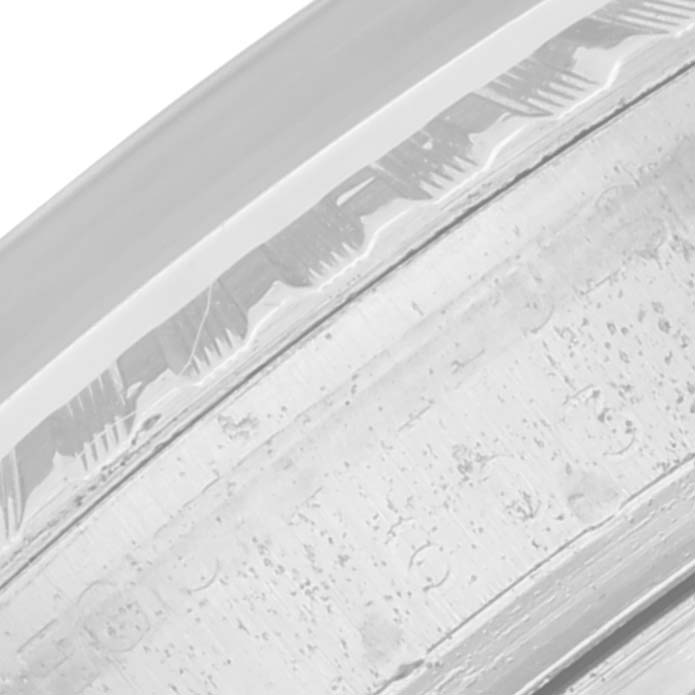 The image shows a close-up side view of a watch bezel, possibly from the Vintage Collection model by Rolex.