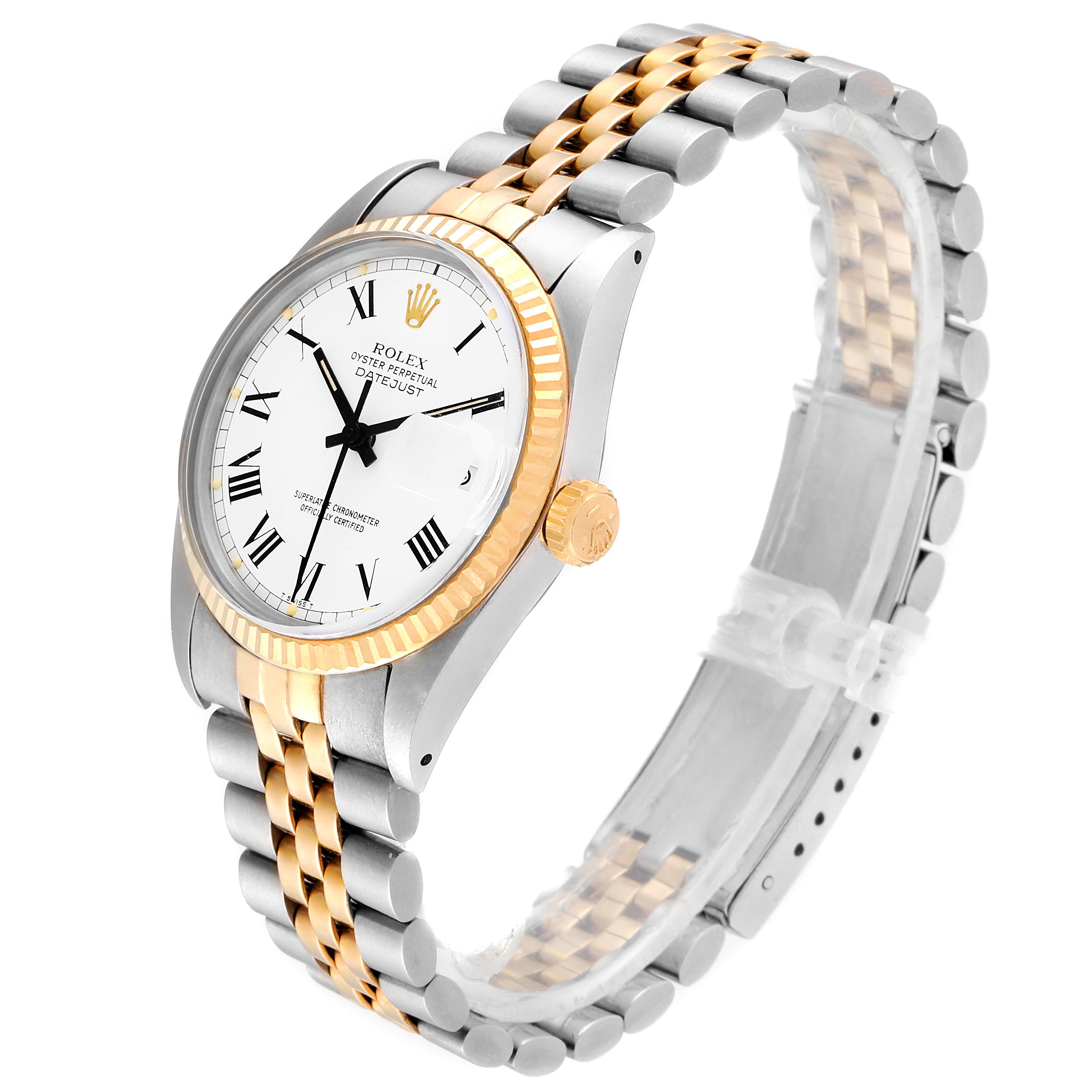 The Rolex Vintage Collection 16013 Men's Steel and Gold (two tone) White Dial 16013 Men's Steel and Gold (two tone) White Dial watch is shown at an angled view, displaying its two-tone band, fluted bezel, white dial, and Roman numeral hour markers.