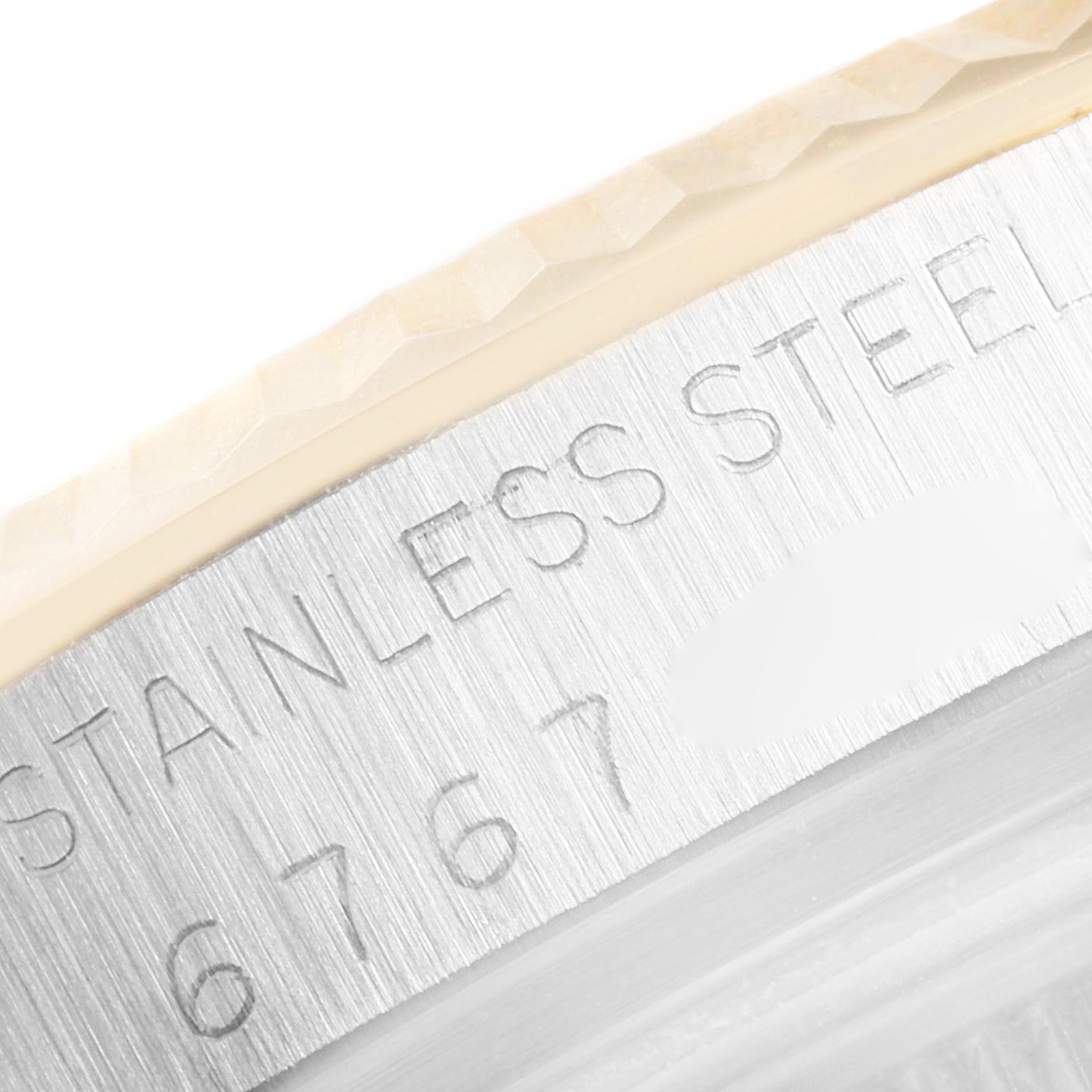 This close-up image shows the side edge and engravings of the Vintage Collection Rolex watch bezel.