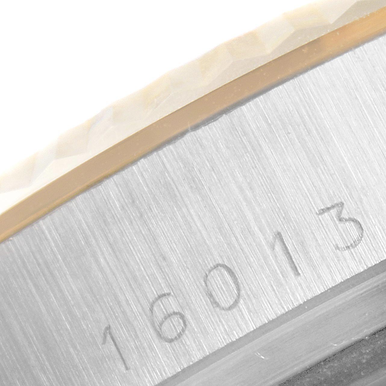 The image shows a close-up of the serial number engraved on the bezel of a Rolex Vintage Collection 16013 Men's Steel and Gold (two tone) White Dial 16013 Men's Steel and Gold (two tone) White Dial model.