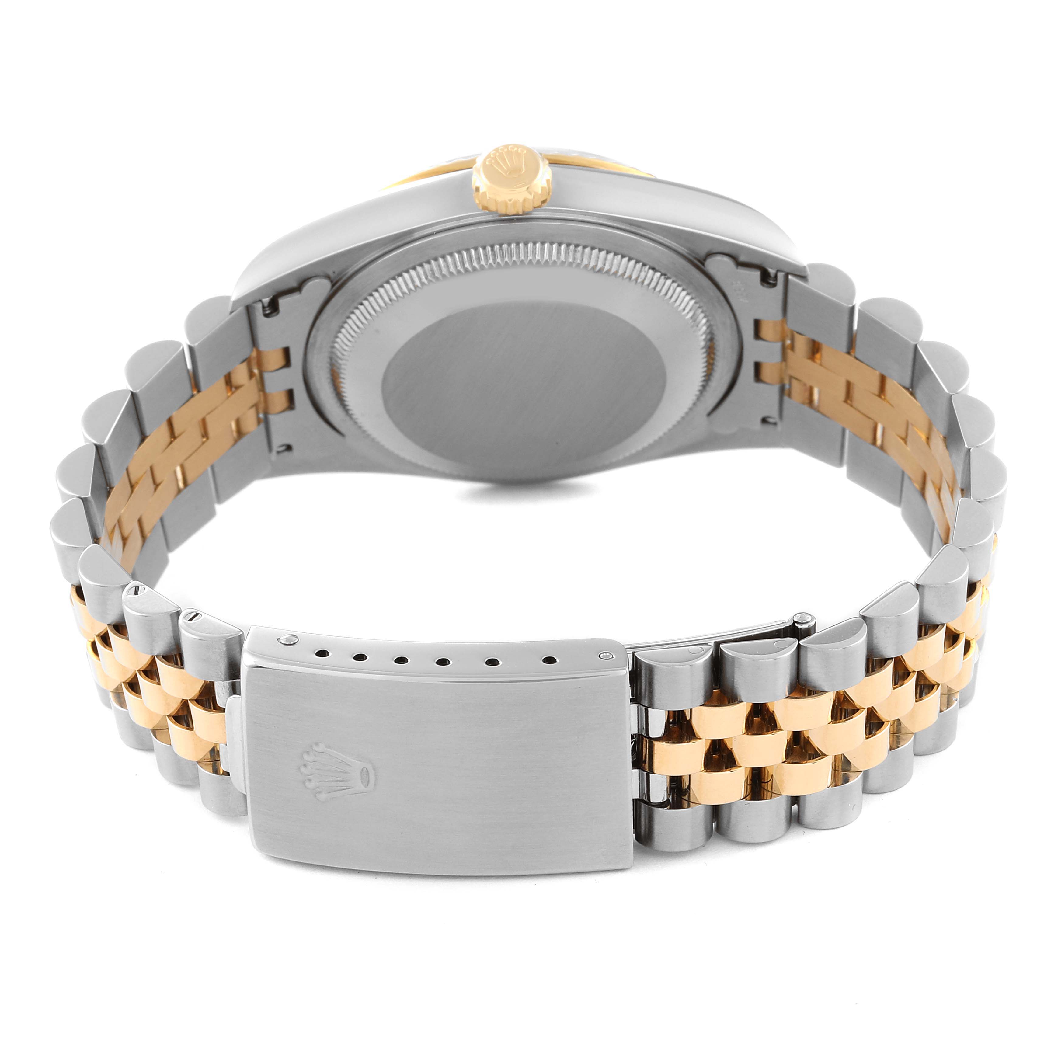 The image shows the back and clasp of a Rolex Datejust 16233 Men's Steel and Gold (two tone) Mother of Pearl Dial 16233 Men's Steel and Gold (two tone) Mother of Pearl Dial watch, highlighting its two-tone metal bracelet.