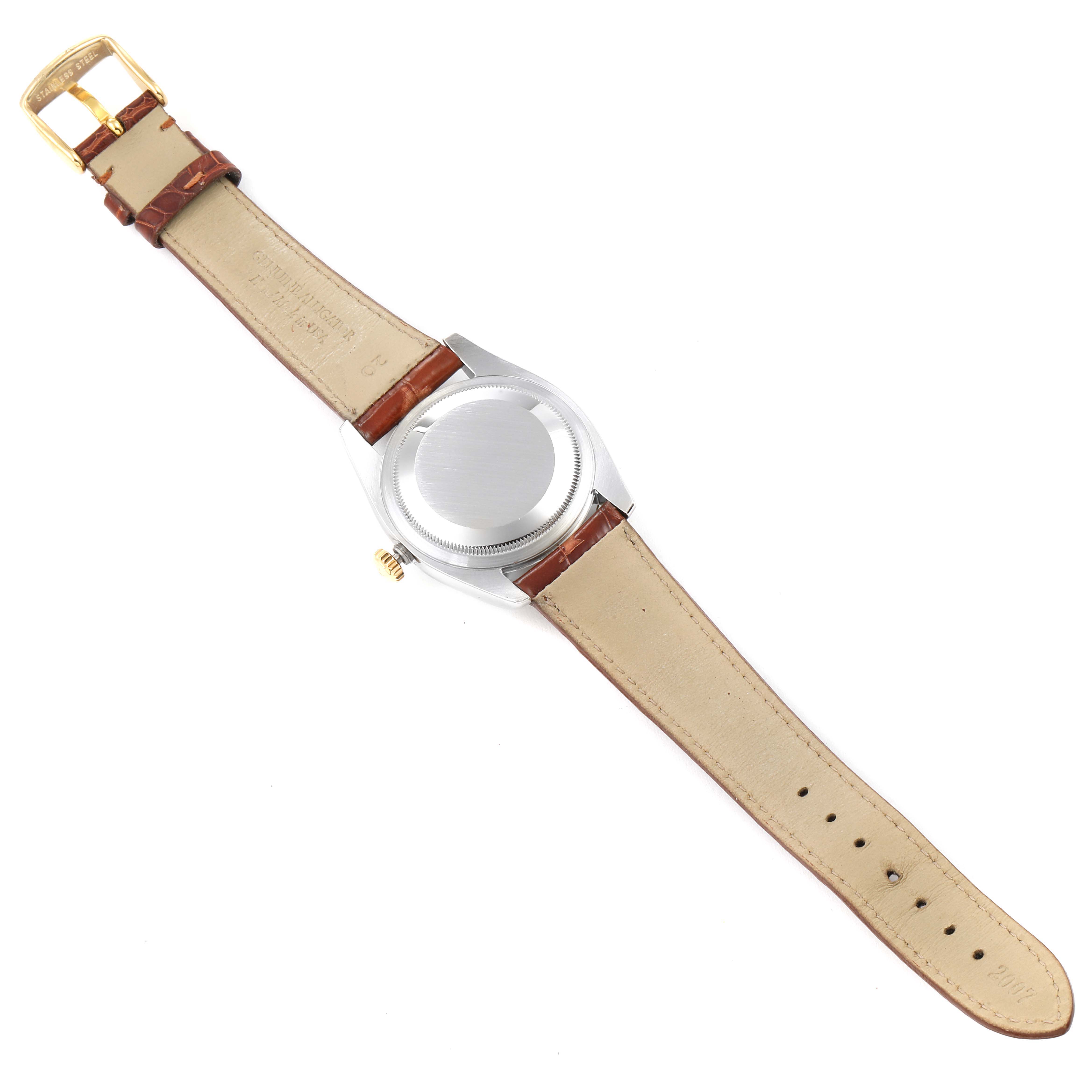 This image shows the back case and leather strap of a Rolex Datejust 116233 Men's Steel and Gold (two tone) White Dial 116233 Men's Steel and Gold (two tone) White Dial watch.