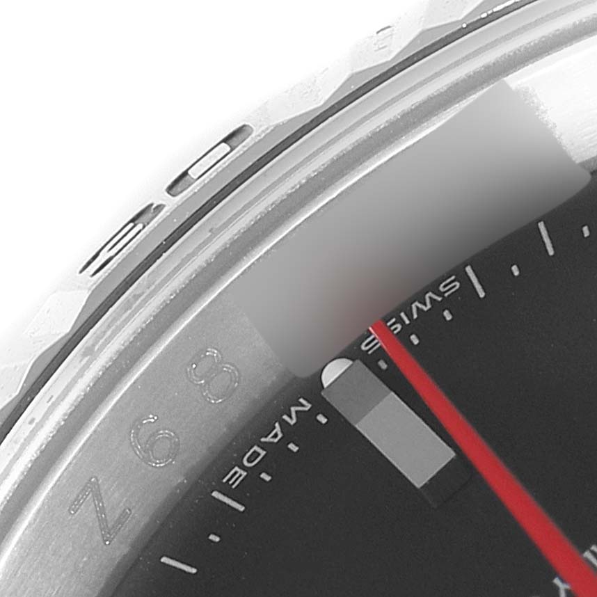 The image shows a close-up of the bezel and part of the dial of a Rolex Turn-o-Graph 116264 Men
s Stainless Steel Black Dial 116264 Men
s Stainless Steel Black Dial watch.