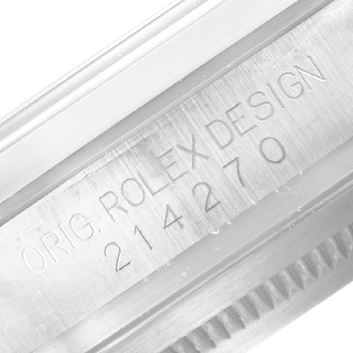 This close-up image shows the engraved serial number and "ORIG. ROLEX DESIGN" marking on the case of a Rolex Explorer 214270 Men
s Stainless Steel Black Dial 214270 Men
s Stainless Steel Black Dial model.