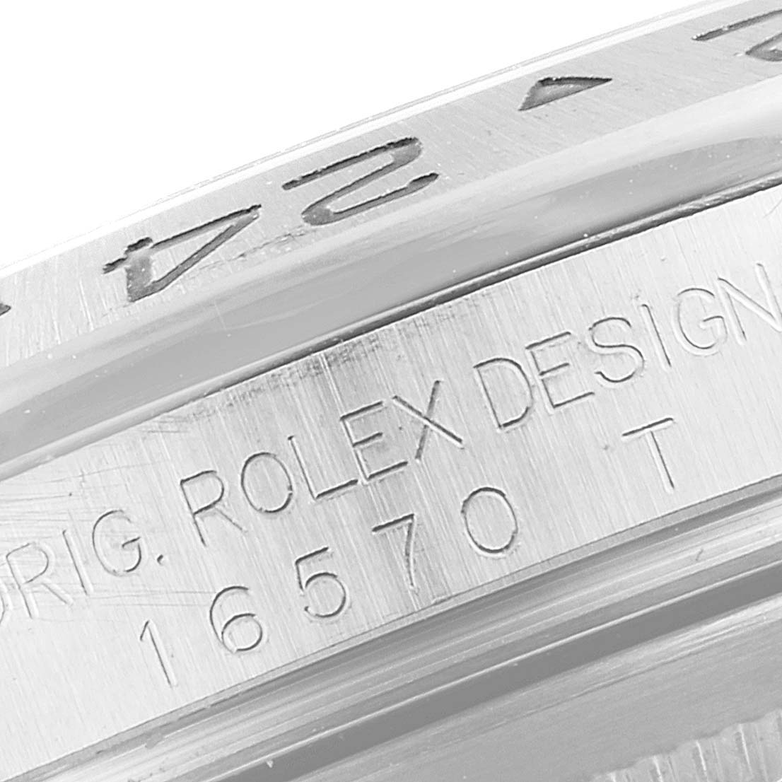 This image shows a close-up of the side engraving and bezel details of the Rolex Explorer 16570 Men's Stainless Steel White Dial 16570 Men's Stainless Steel White Dial model watch.