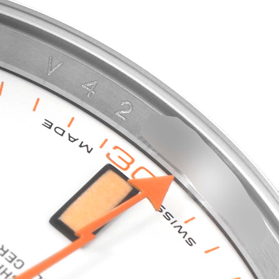 This close-up angle of the Rolex Milgauss 116400V Men's Stainless Steel White Dial 116400V Men's Stainless Steel White Dial watch showcases part of its dial, the "30" marker, and the orange lightning bolt seconds hand.