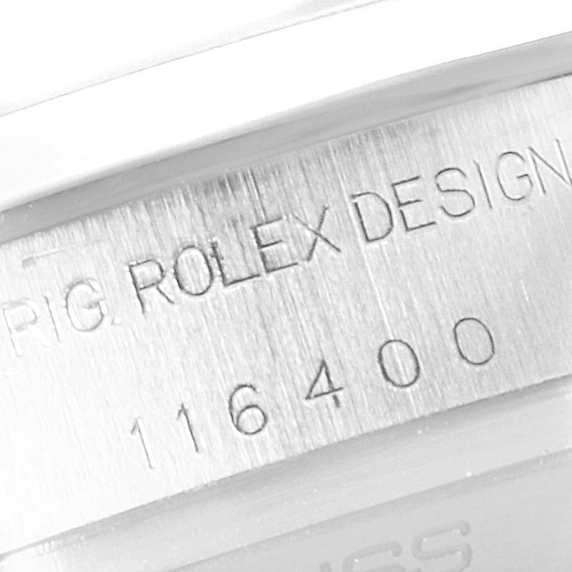 This close-up image shows the engraved model number "116400" on the case of a Rolex Milgauss 116400V Men's Stainless Steel White Dial 116400V Men's Stainless Steel White Dial watch.
