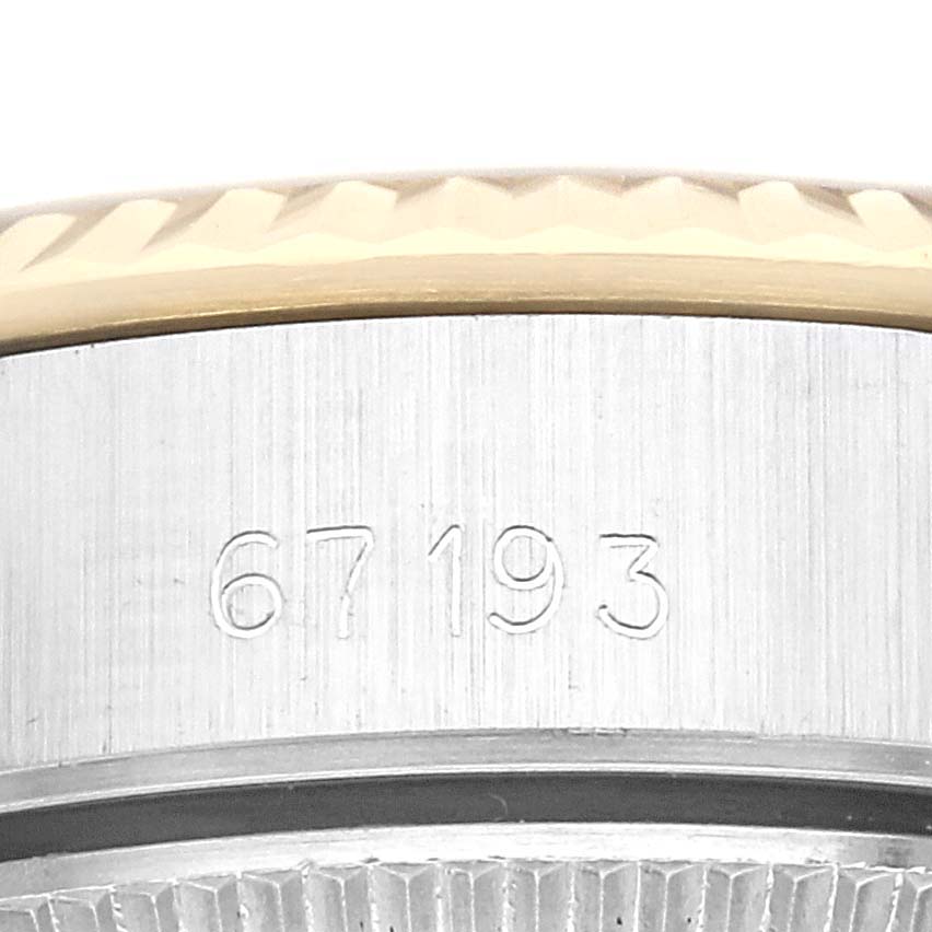 This close-up image shows the model number engraved on the side of the bezel of a Rolex Oyster Perpetual 67193 Women's Stainless Steel Champagne Dial 67193 Women's Stainless Steel Champagne Dial watch.