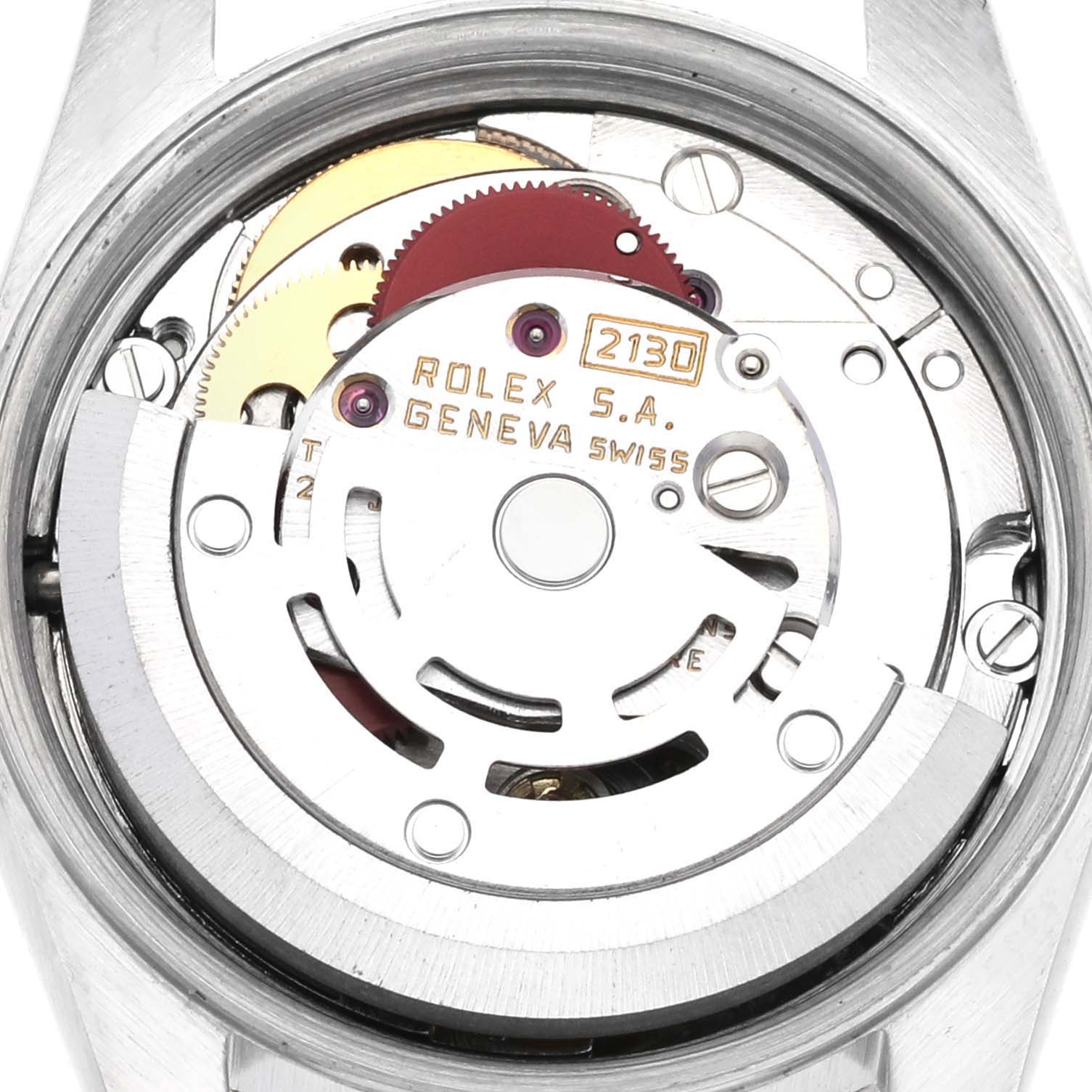 This is a close-up view of the internal mechanism of a Rolex Oyster Perpetual 67193 Women's Stainless Steel Champagne Dial 67193 Women's Stainless Steel Champagne Dial watch, showing gears and inscriptions.