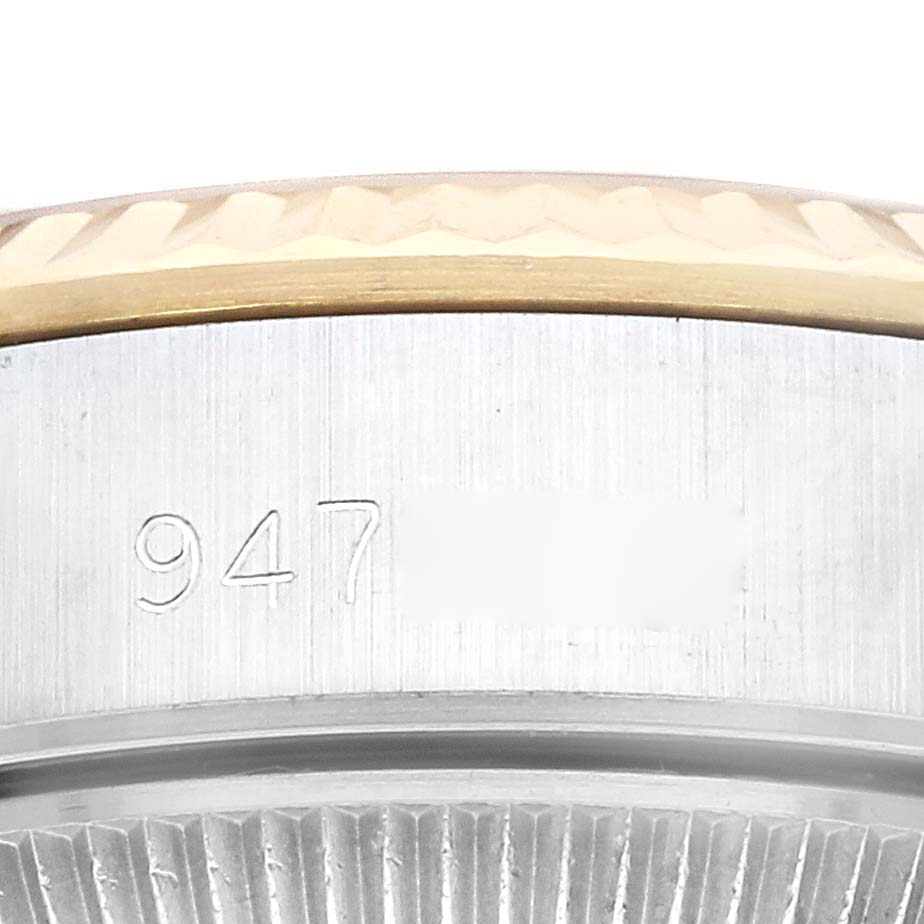 This image shows a close-up of the serial number engraved on the side of the Rolex Oyster Perpetual 67193 Women's Stainless Steel Champagne Dial 67193 Women's Stainless Steel Champagne Dial watch case.