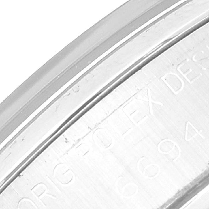 This is a close-up shot of the engraved side of the bezel of a Vintage Collection model by Rolex.