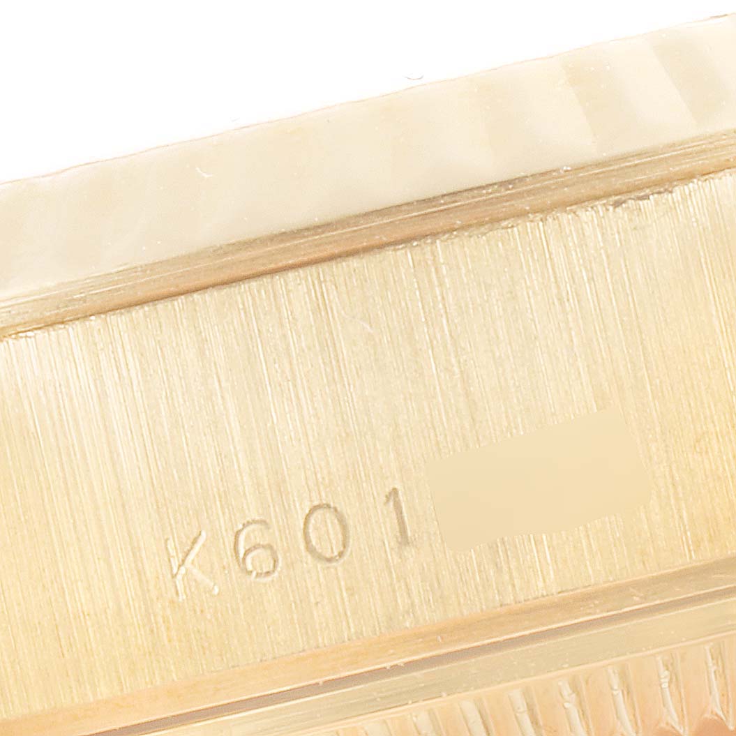 This close-up image shows the side of the case of the Rolex President 79178 Women
s Yellow Gold Champagne Dial 79178 Women
s Yellow Gold Champagne Dial model with visible serial numbers.