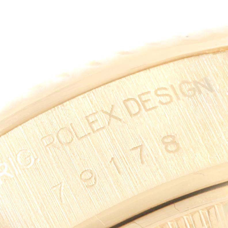 The close-up image shows part of the case back with engraved text of the Rolex President 79178 Women
s Yellow Gold Champagne Dial 79178 Women
s Yellow Gold Champagne Dial model watch.