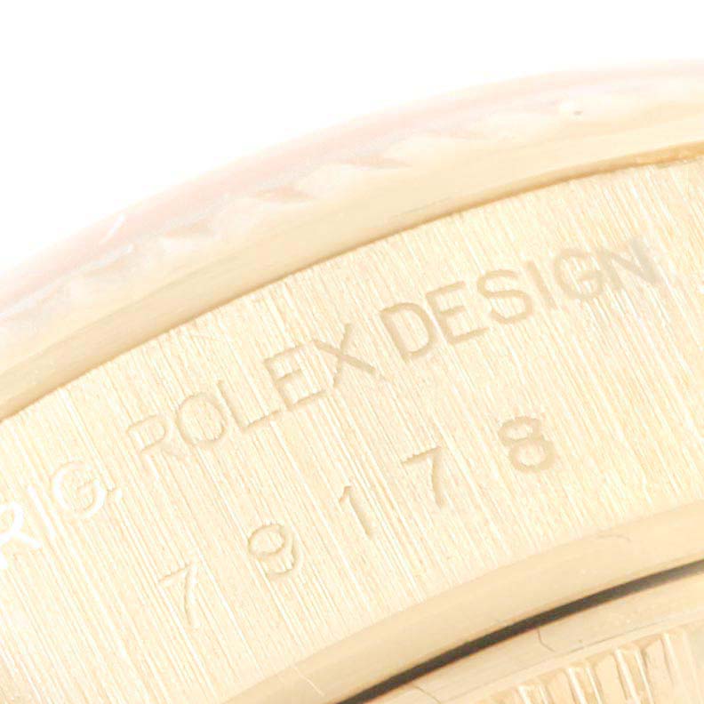 This close-up image shows the engraved case back and part of the bezel of the Rolex President 79178 Women
s Yellow Gold Champagne Dial 79178 Women
s Yellow Gold Champagne Dial model watch.
