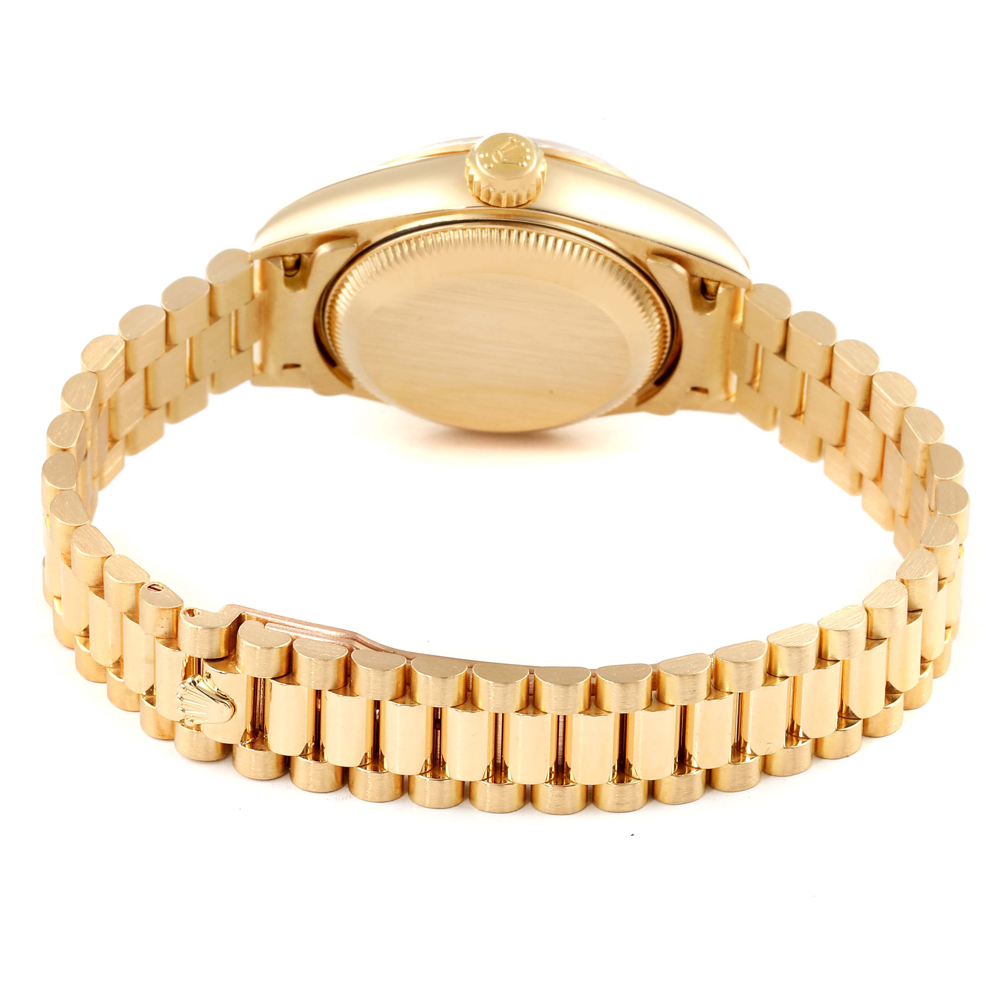 The image shows the back view of a Rolex President 79178 Women
s Yellow Gold Champagne Dial 79178 Women
s Yellow Gold Champagne Dial model watch, featuring its gold case and bracelet.