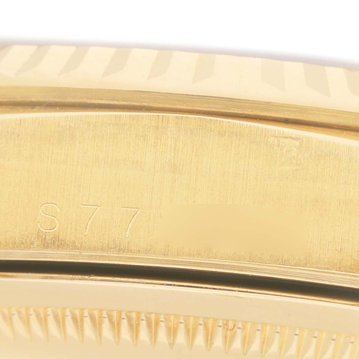 The image shows a close-up of the side view of a Rolex President 18238 Men's Yellow Gold Champagne Dial watch, focusing on part of the case and the edge of the bezel.