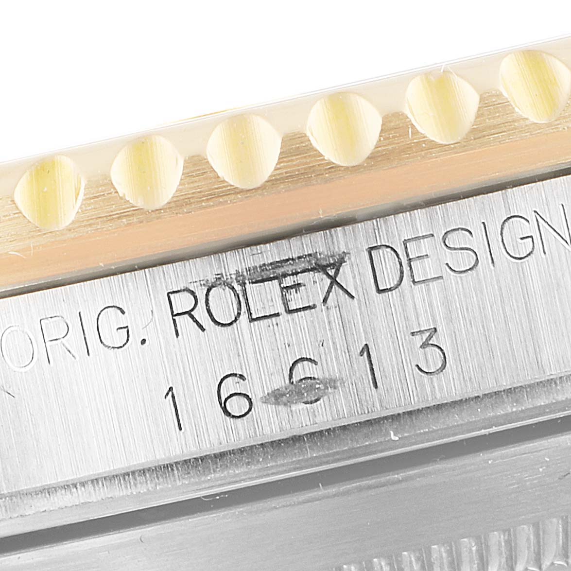 This close-up image shows the bezel and part of the case of a Rolex Submariner 16613 Men's Steel and Gold (two tone) Black Dial 16613 Men's Steel and Gold (two tone) Black Dial watch, displaying the model number 16613.