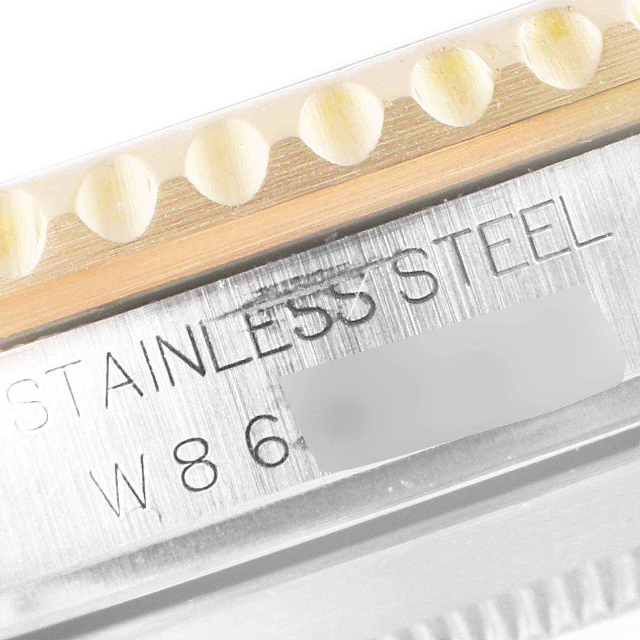 The image shows a close-up of the stainless steel case and bezel of a Rolex Submariner 16613 Men's Steel and Gold (two tone) Black Dial 16613 Men's Steel and Gold (two tone) Black Dial watch.