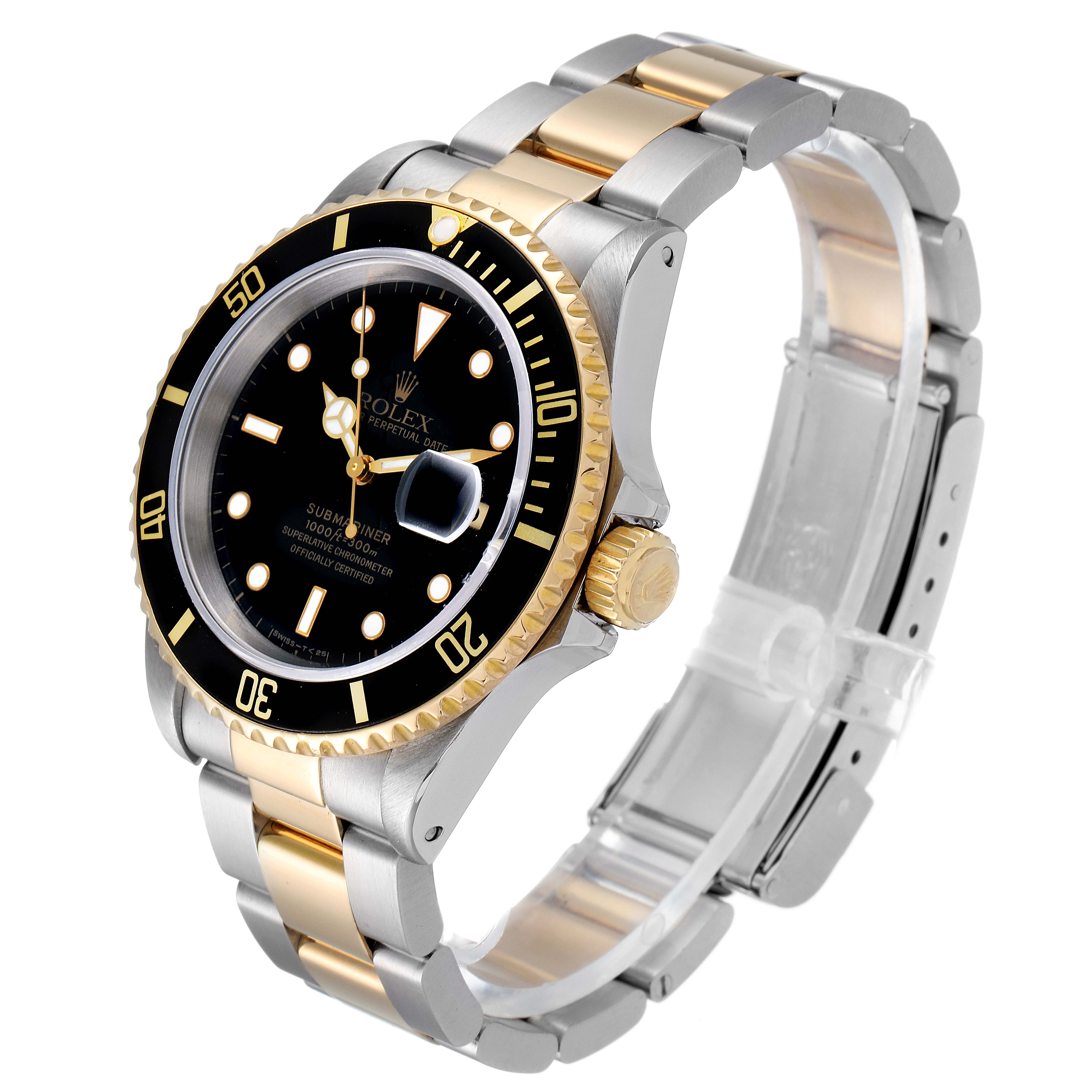 The Rolex Submariner 16613 Men's Steel and Gold (two tone) Black Dial 16613 Men's Steel and Gold (two tone) Black Dial watch is shown at a three-quarter angle, highlighting its black dial, gold bezel, and two-tone bracelet.