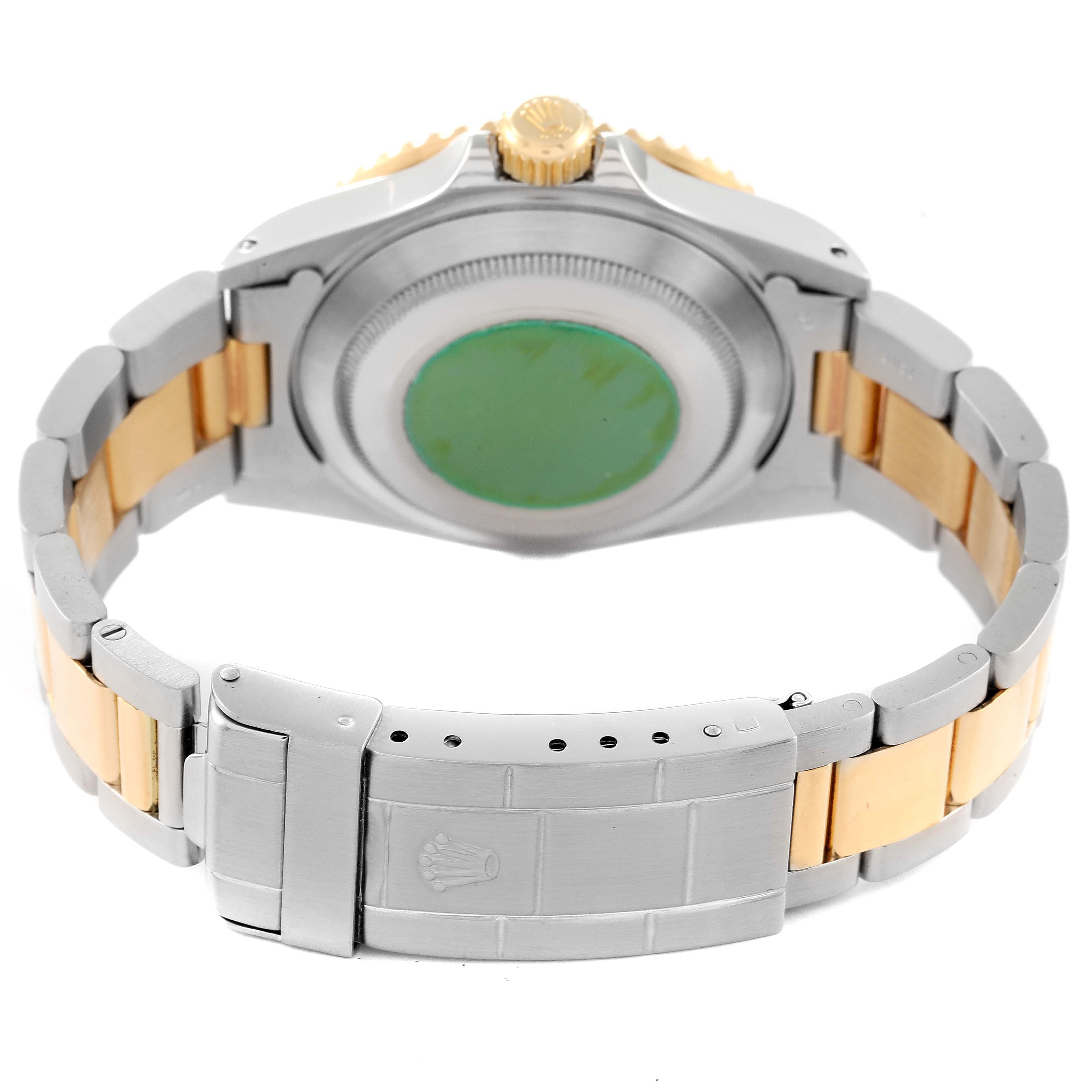 The image shows the back case and bracelet of a Rolex Submariner 16613 Men's Steel and Gold (two tone) Blue Dial 16613 Men's Steel and Gold (two tone) Blue Dial watch from a rear angle.