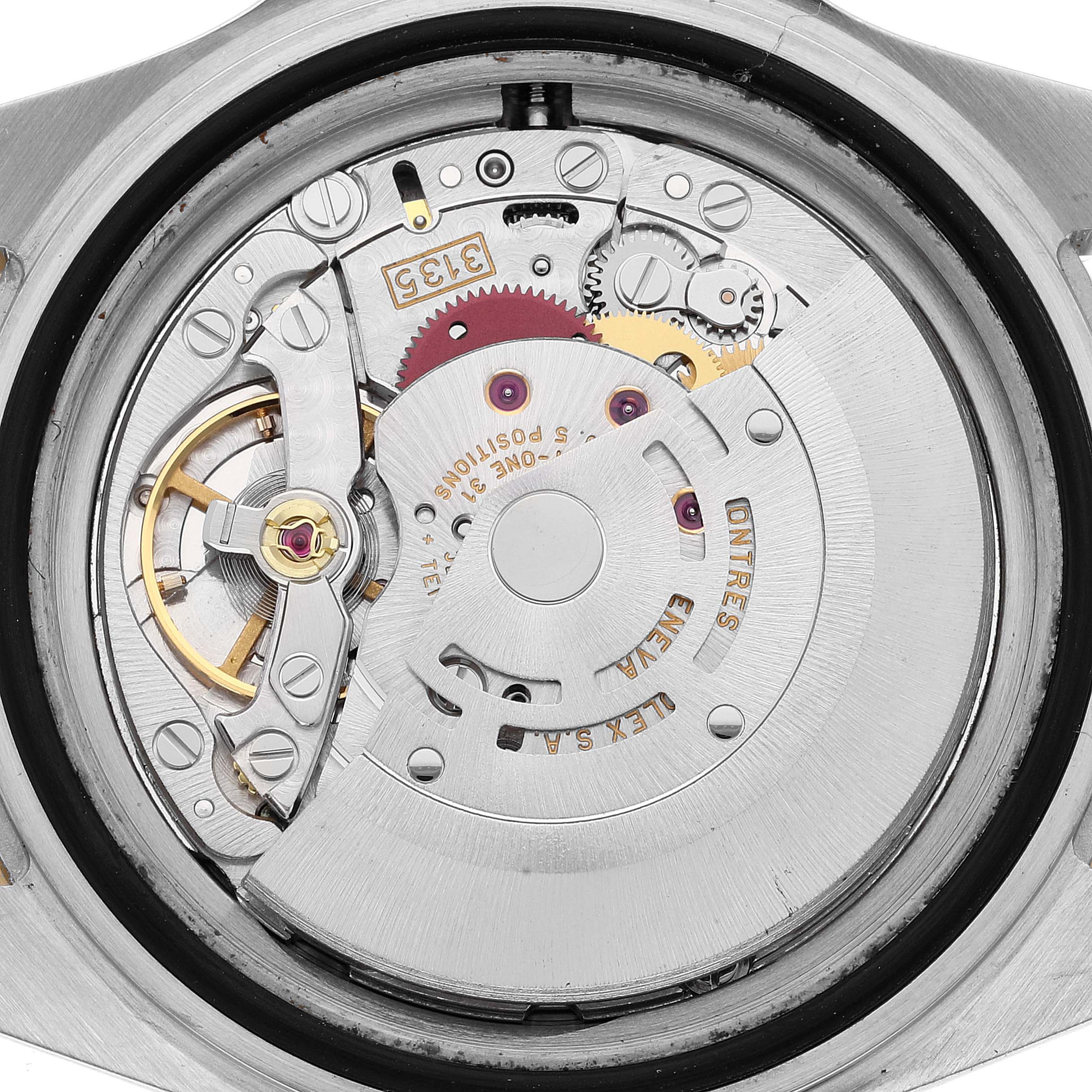 This is a close-up view of the internal mechanism and movement of a Rolex Submariner 16613 Men's Steel and Gold (two tone) Blue Dial 16613 Men's Steel and Gold (two tone) Blue Dial watch.