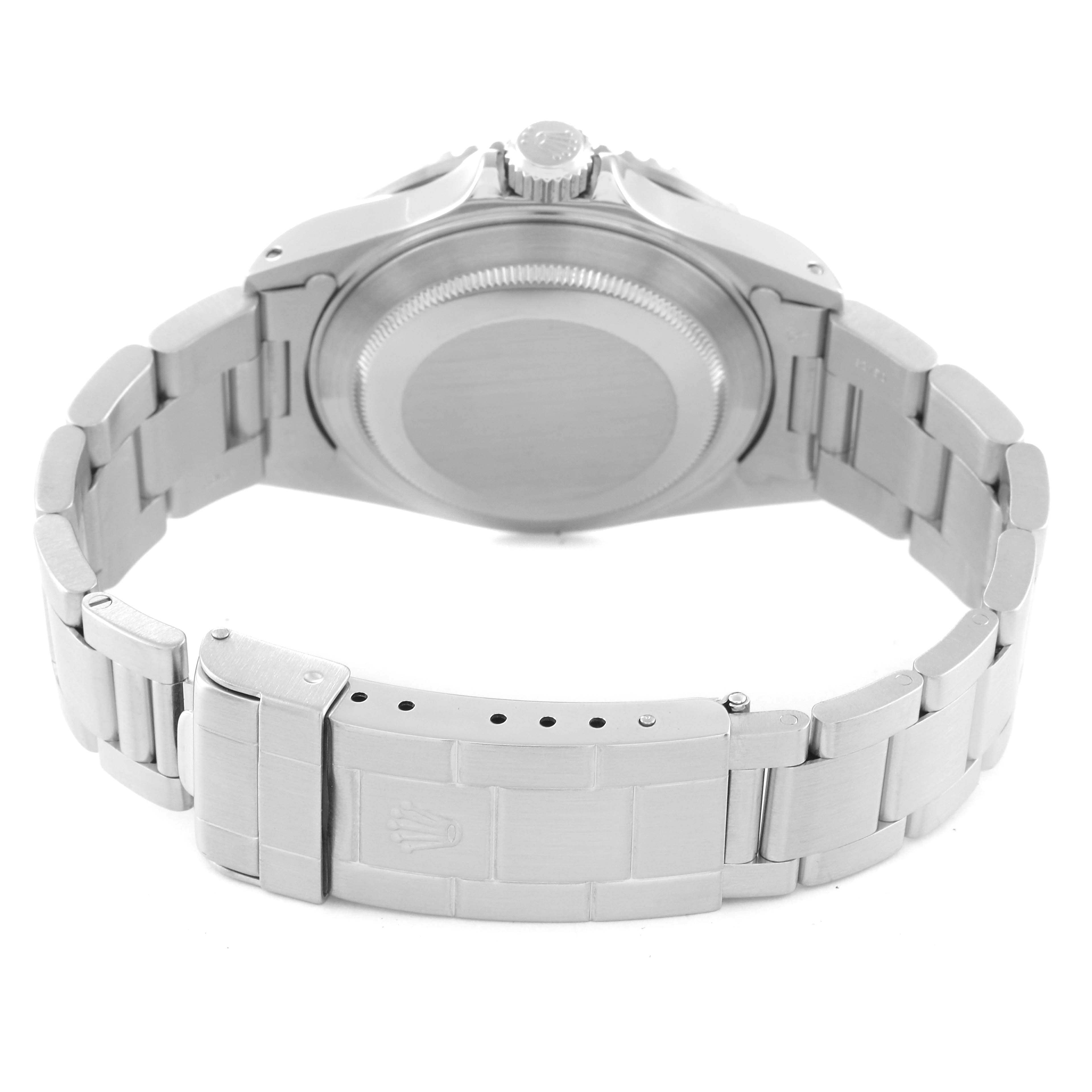 The image shows the back side of a Rolex Submariner 16610 Men
s Stainless Steel Black Dial 16610 Men
s Stainless Steel Black Dial watch, highlighting the case back and stainless steel bracelet with the clasp.