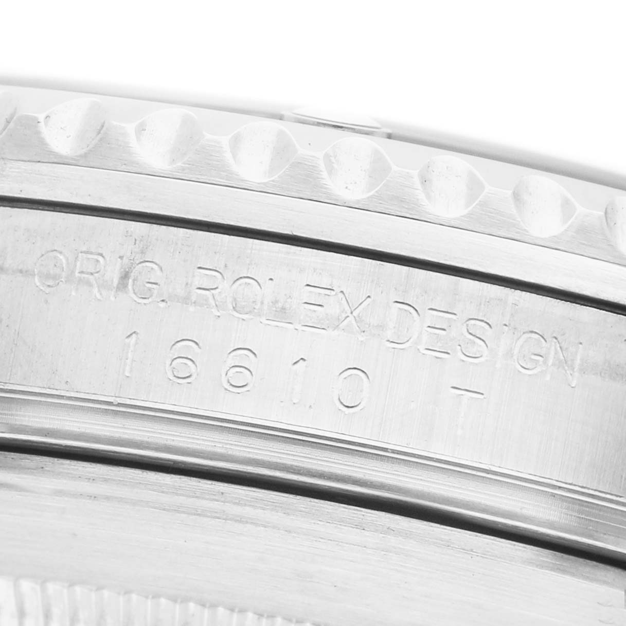 The image shows the side of a Rolex Submariner 16610 Men's Stainless Steel Black Dial, focusing on the engraved bezel and case with model details.