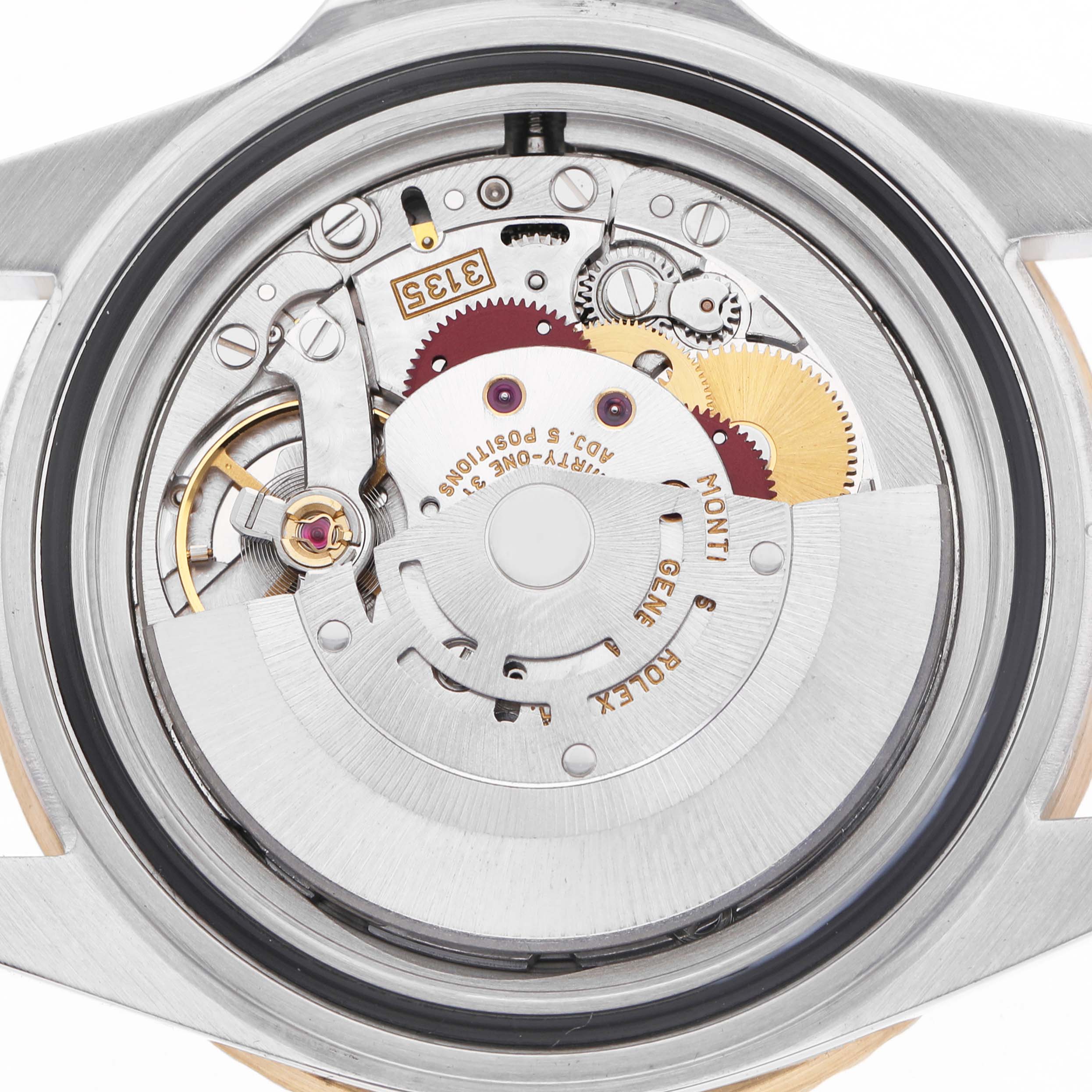 The image shows the internal mechanism of a Rolex Submariner 16613 Men's Steel and Gold (two tone) Champagne Dial, focusing on the movement from a rear angle.