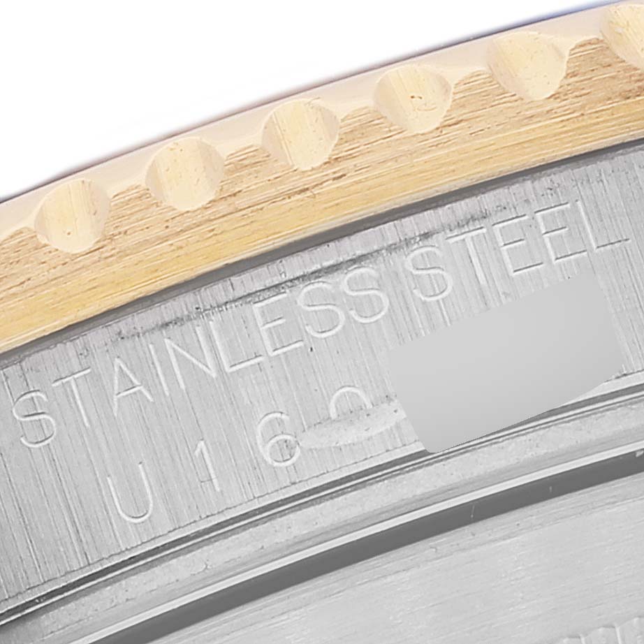 This image shows a close-up of the side and case back of a Rolex Submariner 16613 Men's Steel and Gold (two tone) Champagne Dial 16613 Men's Steel and Gold (two tone) Champagne Dial, highlighting the stainless steel material.