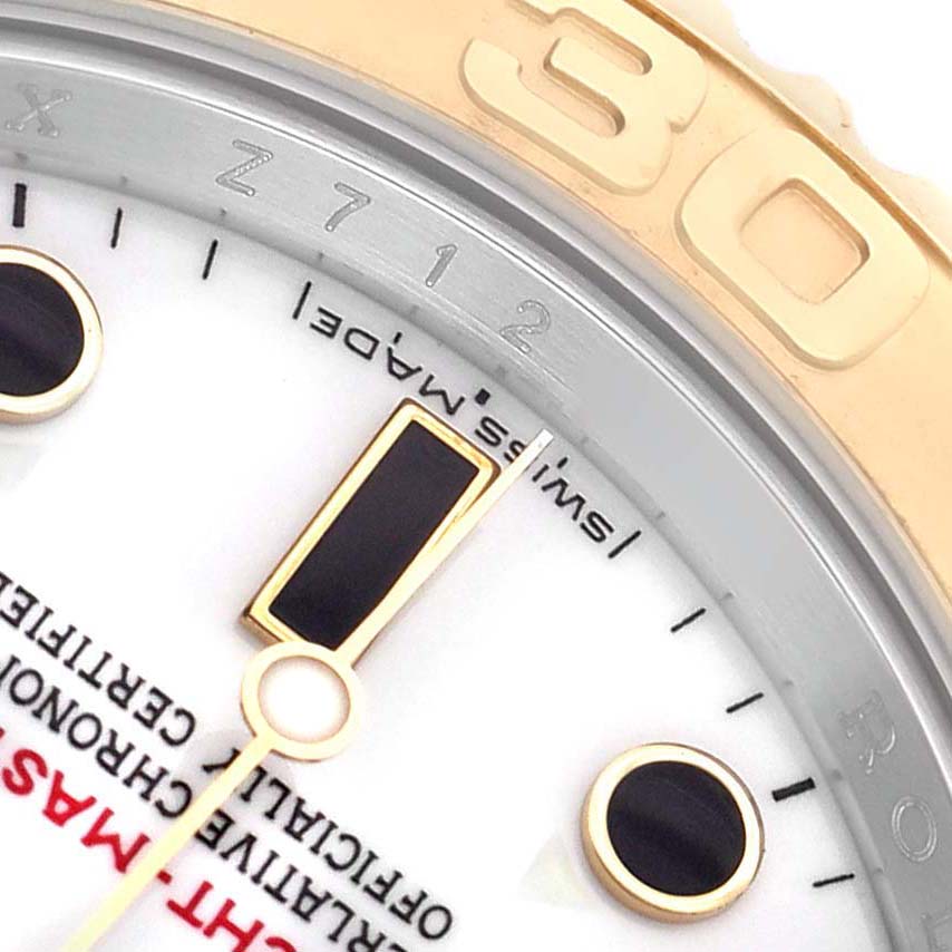 The image shows a close-up of the Yacht-Master dial and bezel by Rolex, highlighting the hour markers and minute markings.