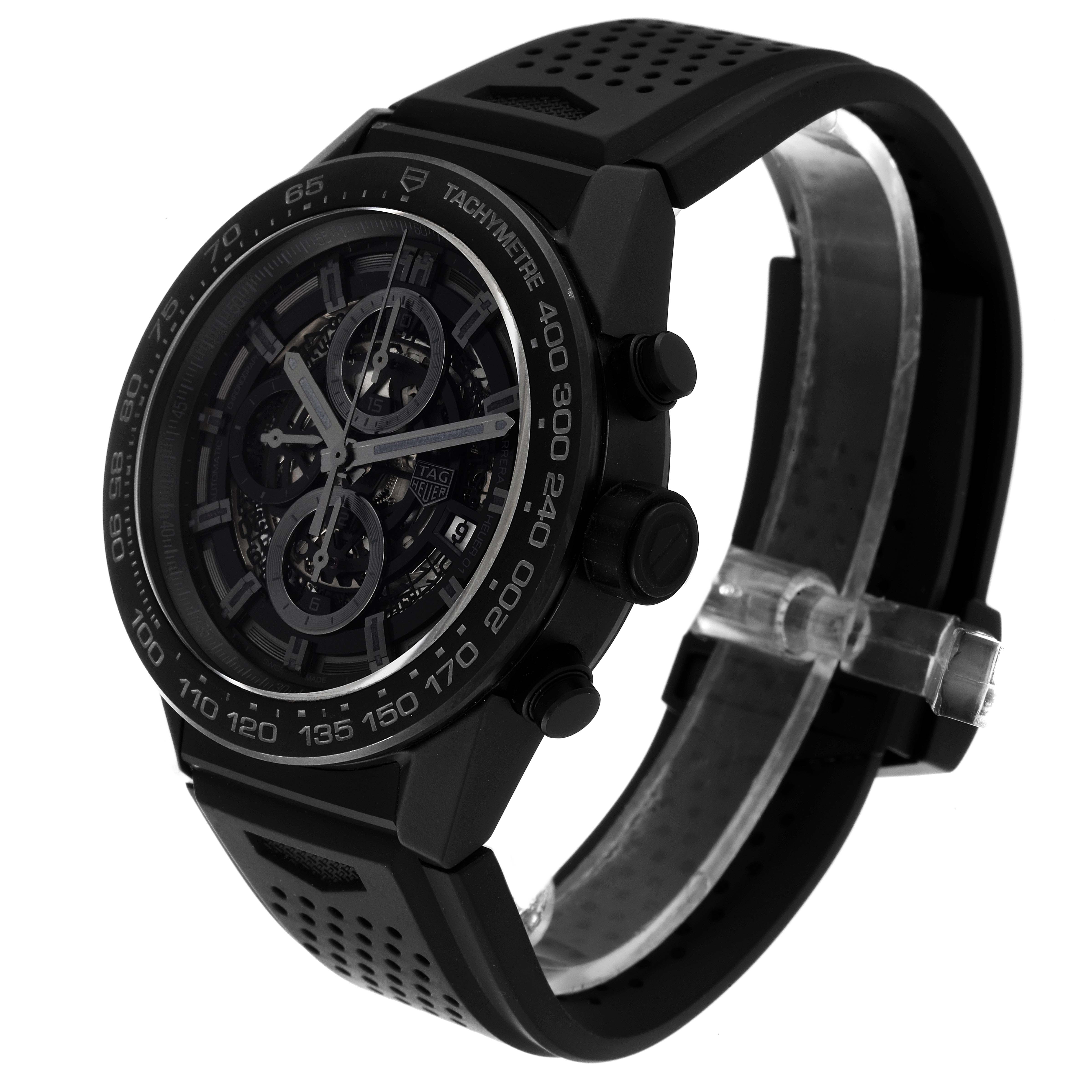 The Tag Heuer Carrera CAR2A91 Men's Ceramic Black Dial CAR2A91 Men's Ceramic Black Dial watch is shown at a three-quarter angle, displaying its face, side buttons, and perforated strap.