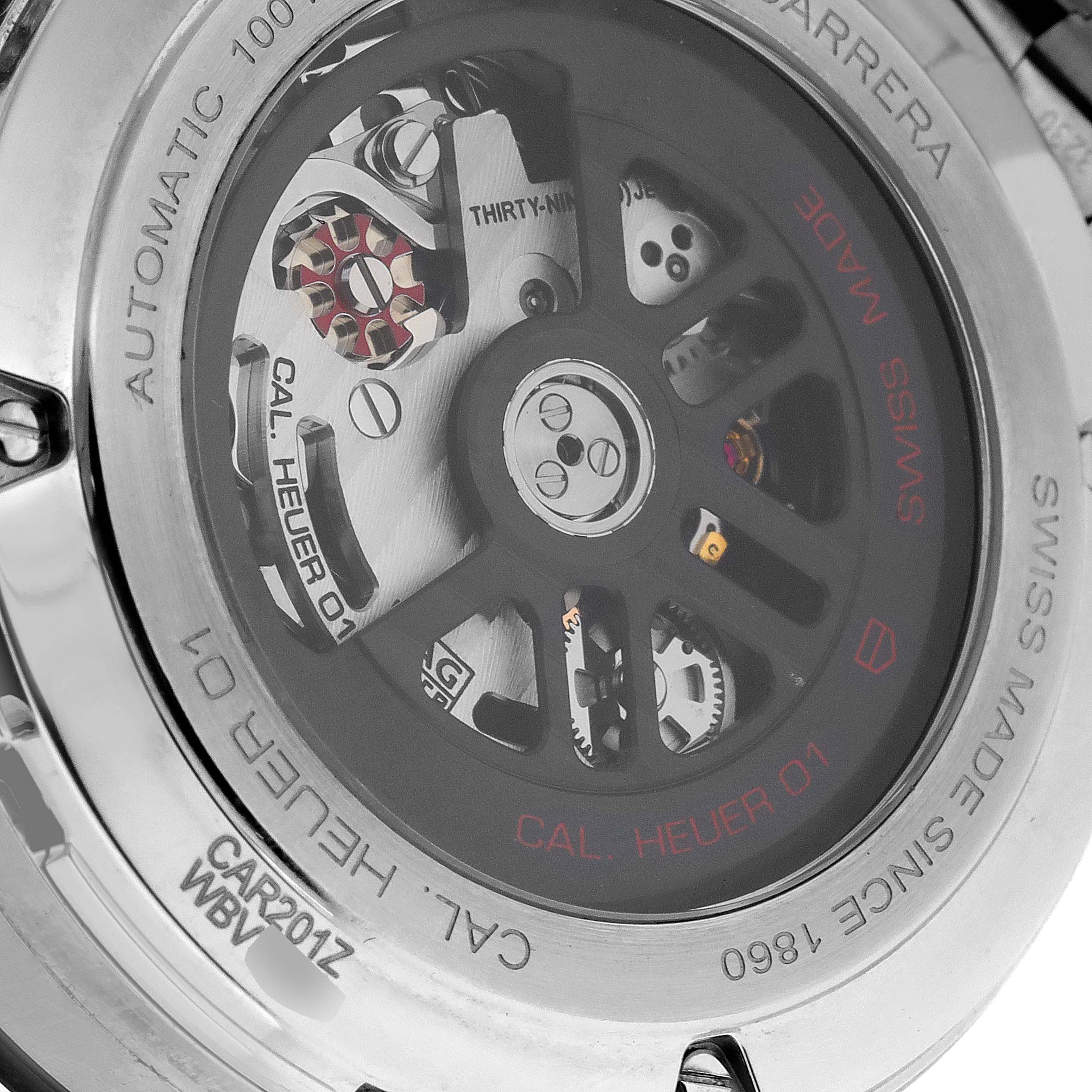 This image shows the back of a Tag Heuer Carrera CAR201Z.BA0714 Men's Stainless Steel Black Dial CAR201Z.BA0714 Men's Stainless Steel Black Dial watch, revealing the movement and inner mechanics marked with "Cal. Heuer 01."