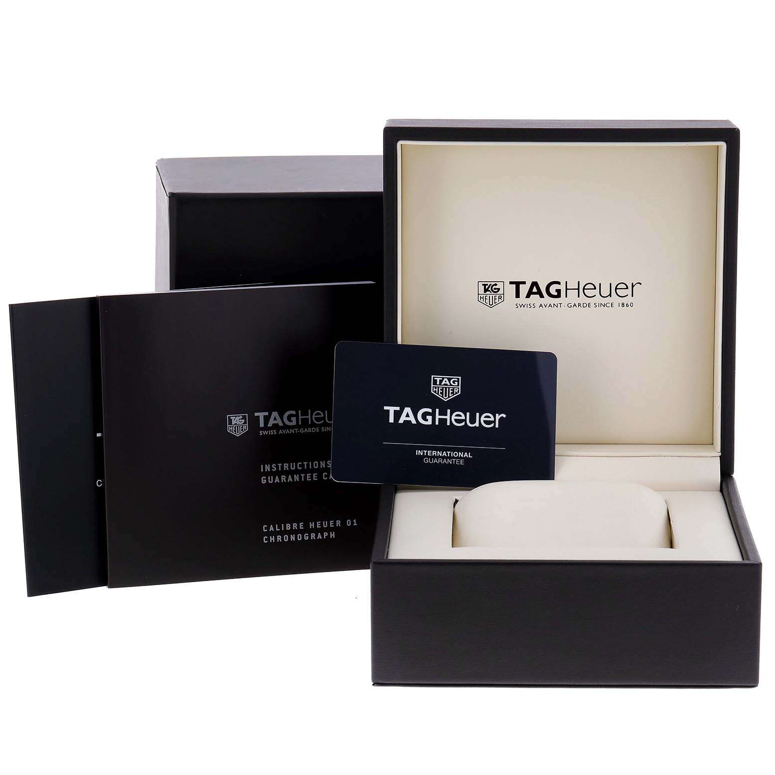 The image shows the box and documentation for a Carrera model by Tag Heuer, including the international guarantee card.