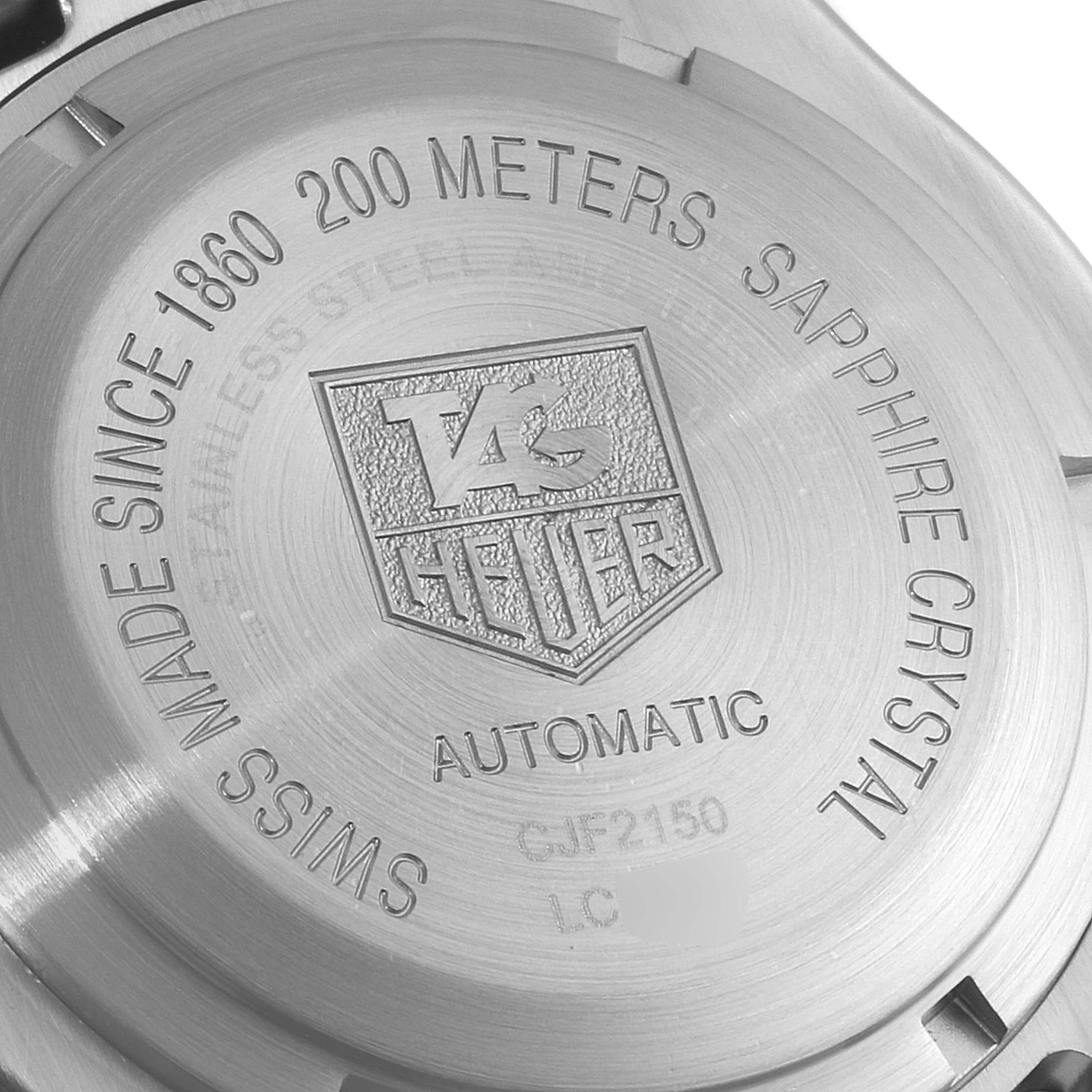 The image shows the case back of a Tag Heuer Link CJF2150.BB0595 Men's Steel and Gold (two tone) Silver Dial CJF2150.BB0595 Men's Steel and Gold (two tone) Silver Dial watch, highlighting its specifications and logo from a close-up angle.