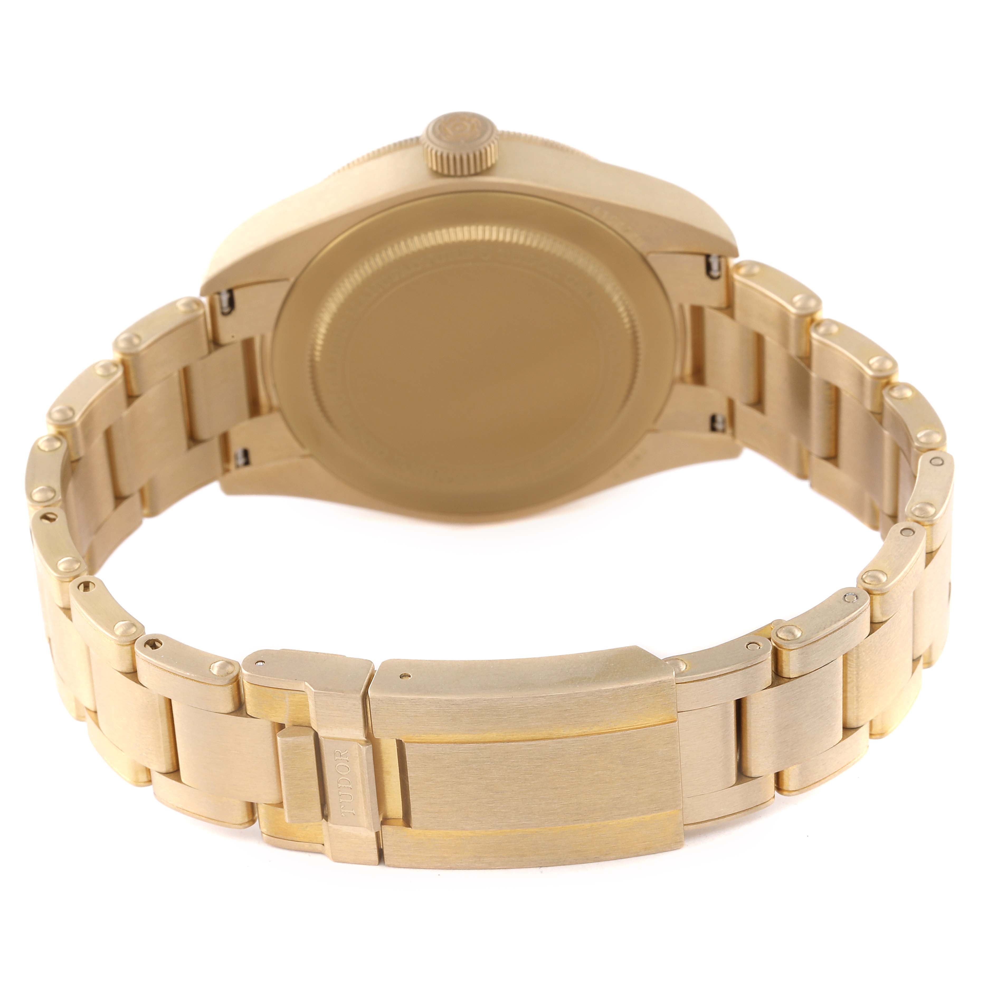 The image shows the back view of a Tudor Heritage Black Bay M79012M-0001 Men's Bronze Brown Dial M79012M-0001 Men's Bronze Brown Dial watch, highlighting the case back, crown, and bracelet with a clasp.