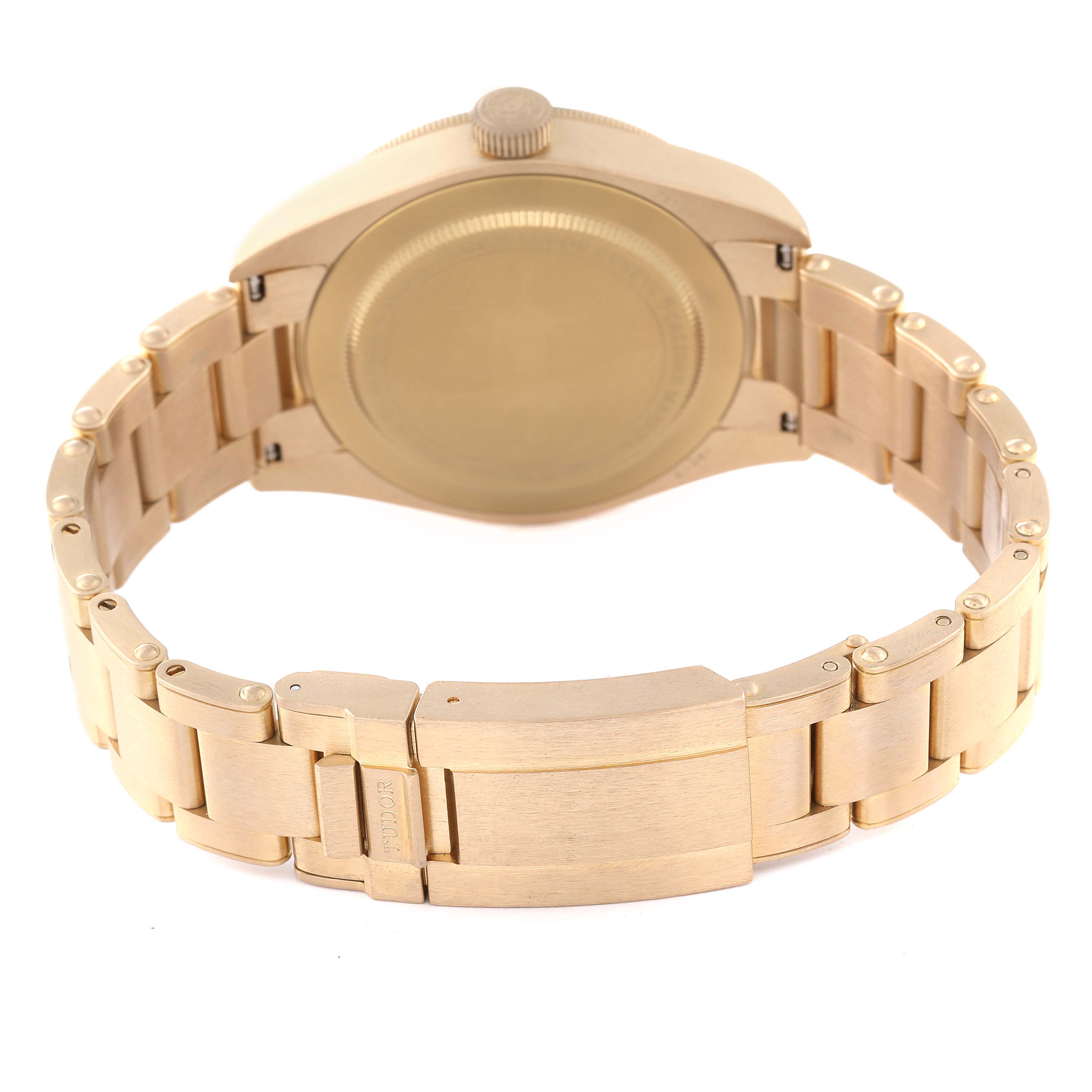 The image shows the back and bracelet of a gold Tudor Heritage Black Bay M79012M-0001 Men's Bronze Brown Dial M79012M-0001 Men's Bronze Brown Dial model watch from a rear angle.