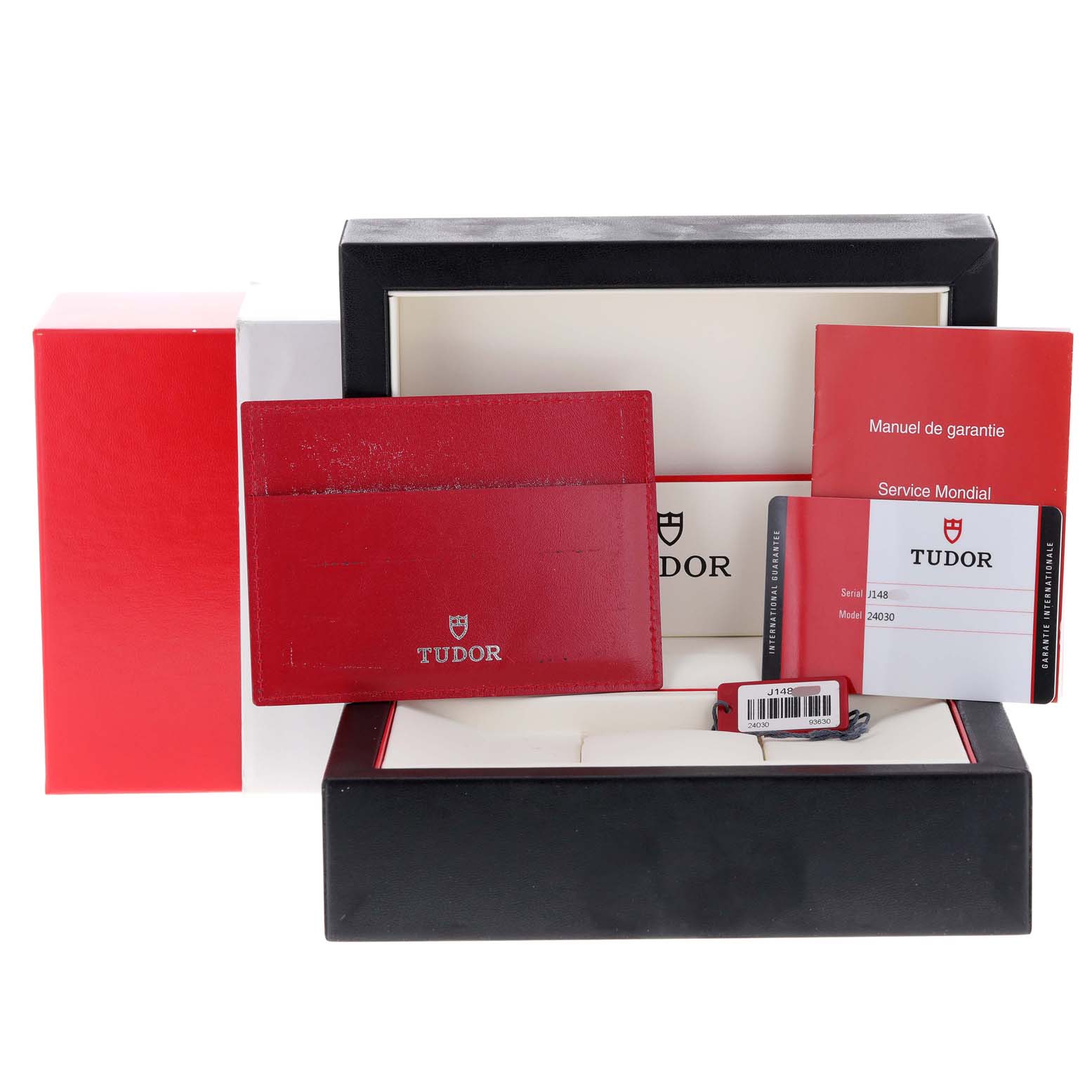 The image shows an accessory set for a Tudor Hydronaut 24030 Women's Stainless Steel Black Dial 24030 Women's Stainless Steel Black Dial watch, including a box, manual, warranty card, and a red cardholder.