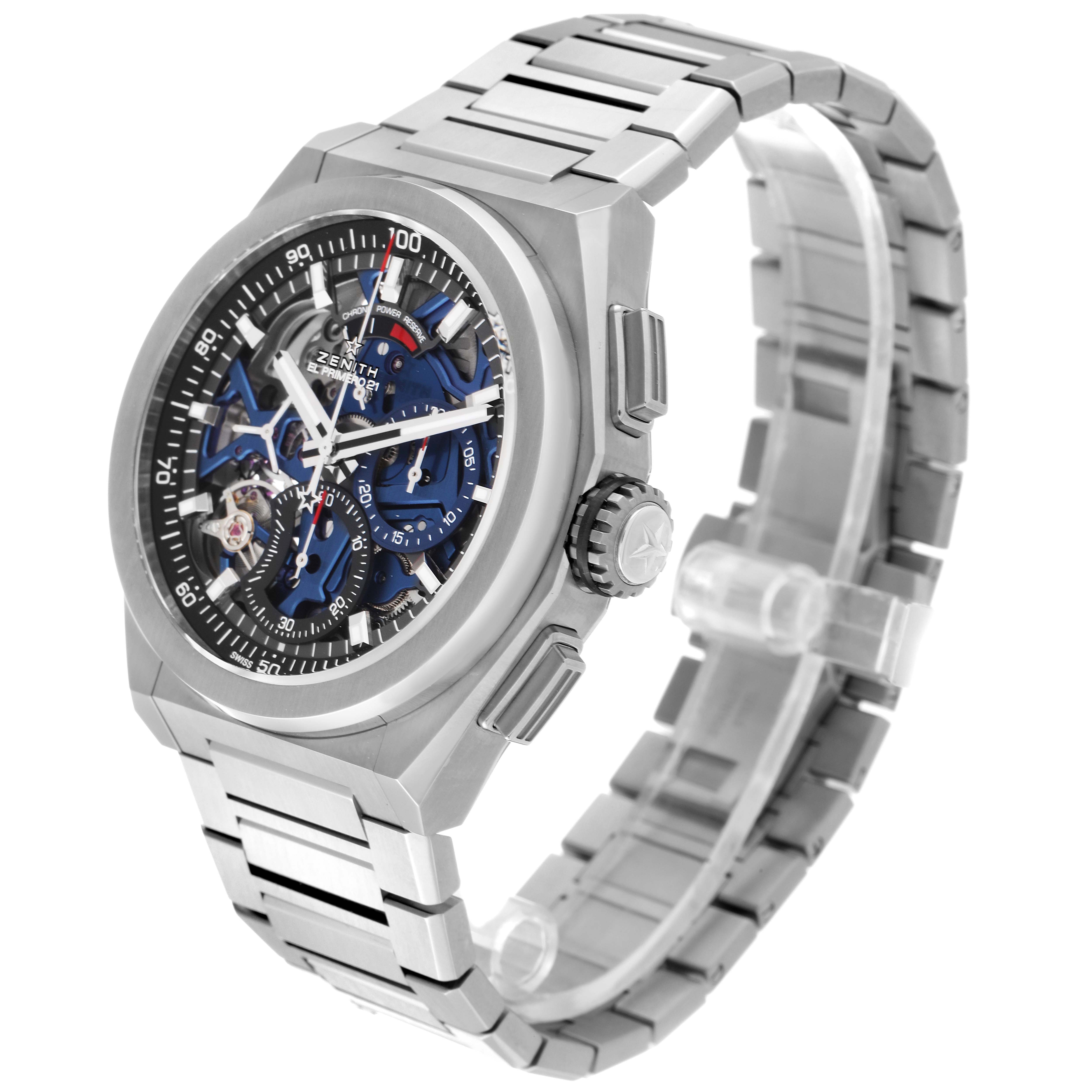 The image shows a Zenith Defy 95.9002.9004/78.M9000 Men's Titanium Grey Dial 95.9002.9004/78.M9000 Men's Titanium Grey Dial watch viewed at an oblique angle, focusing on the face, bezel, crown, and bracelet.